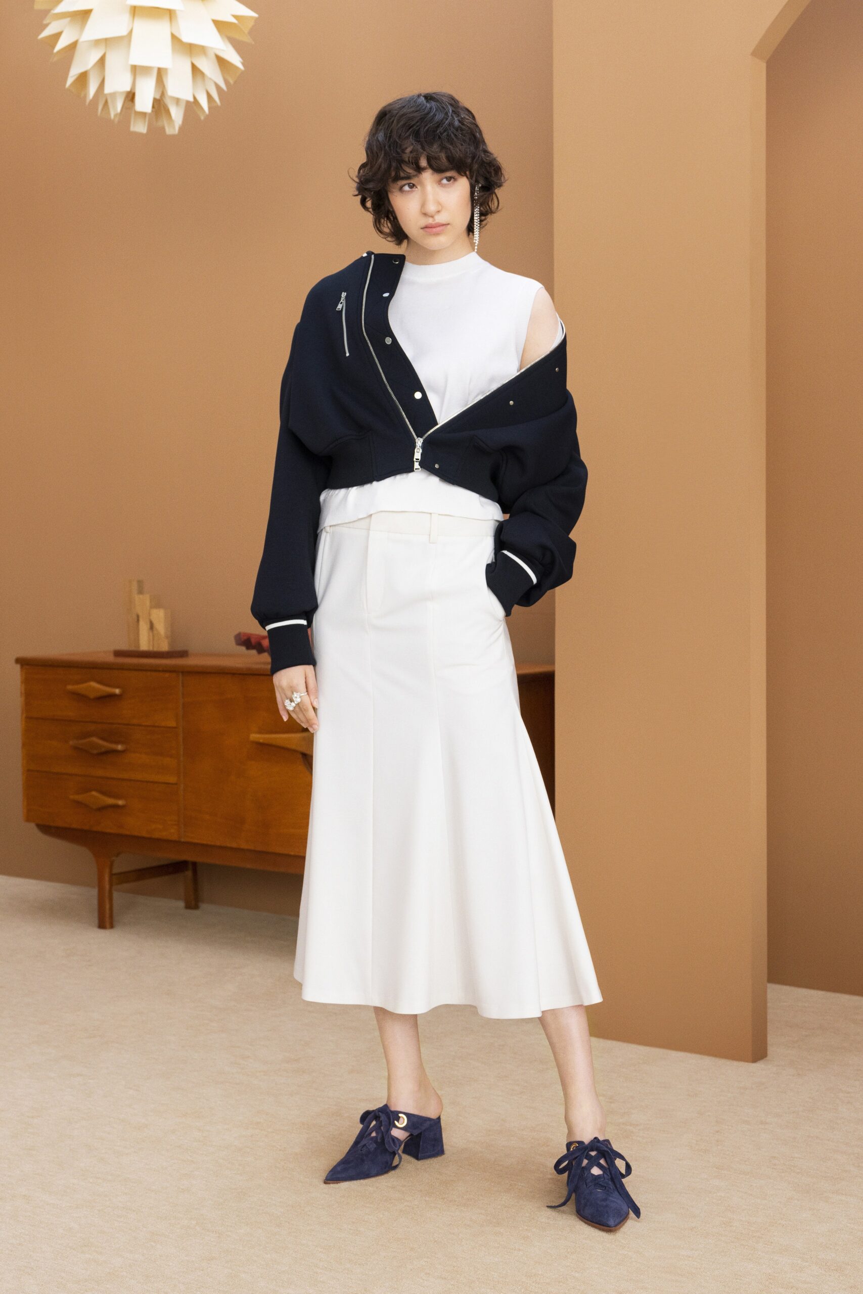 black jacket white top midi skirt