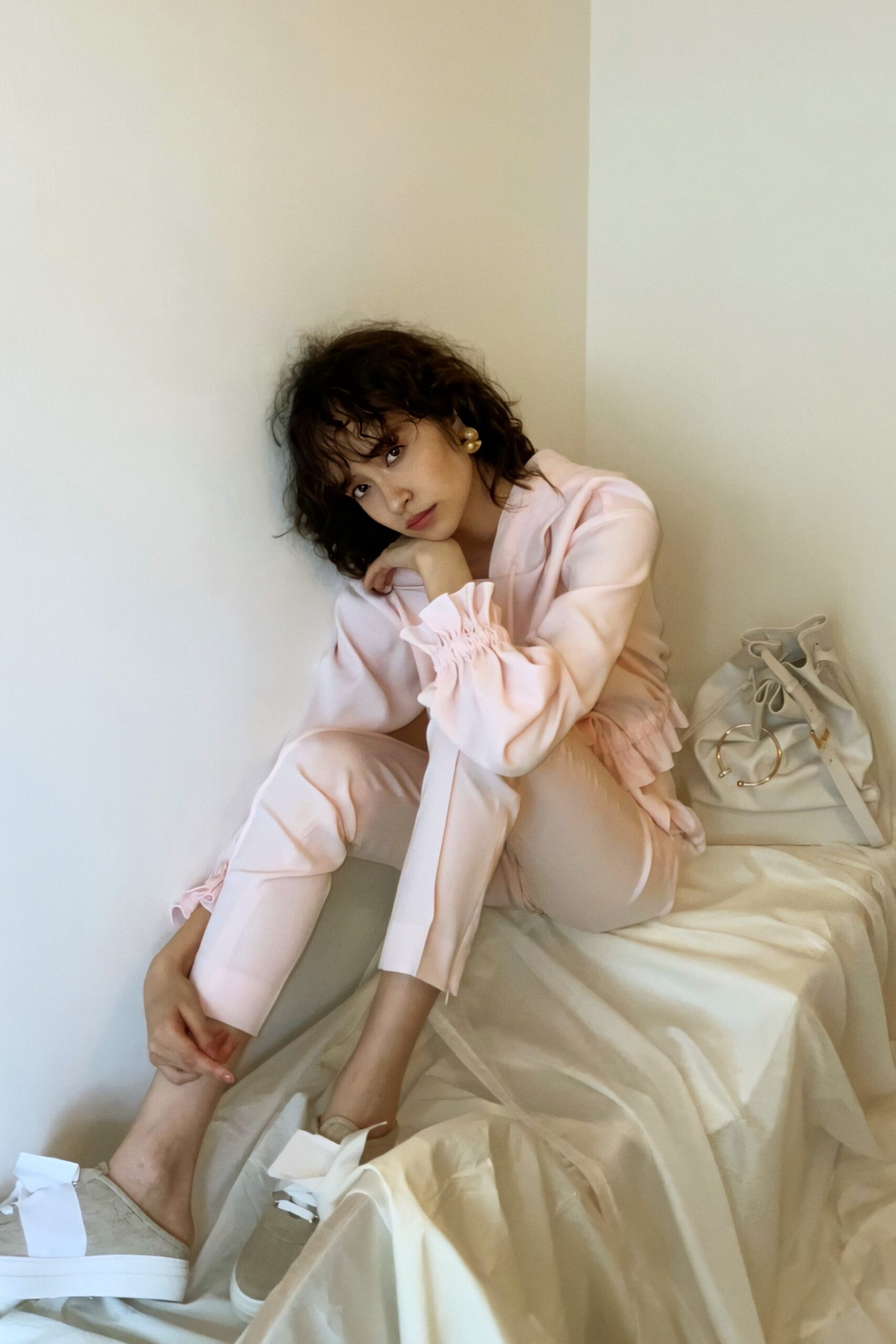 pink fitted top with white pants