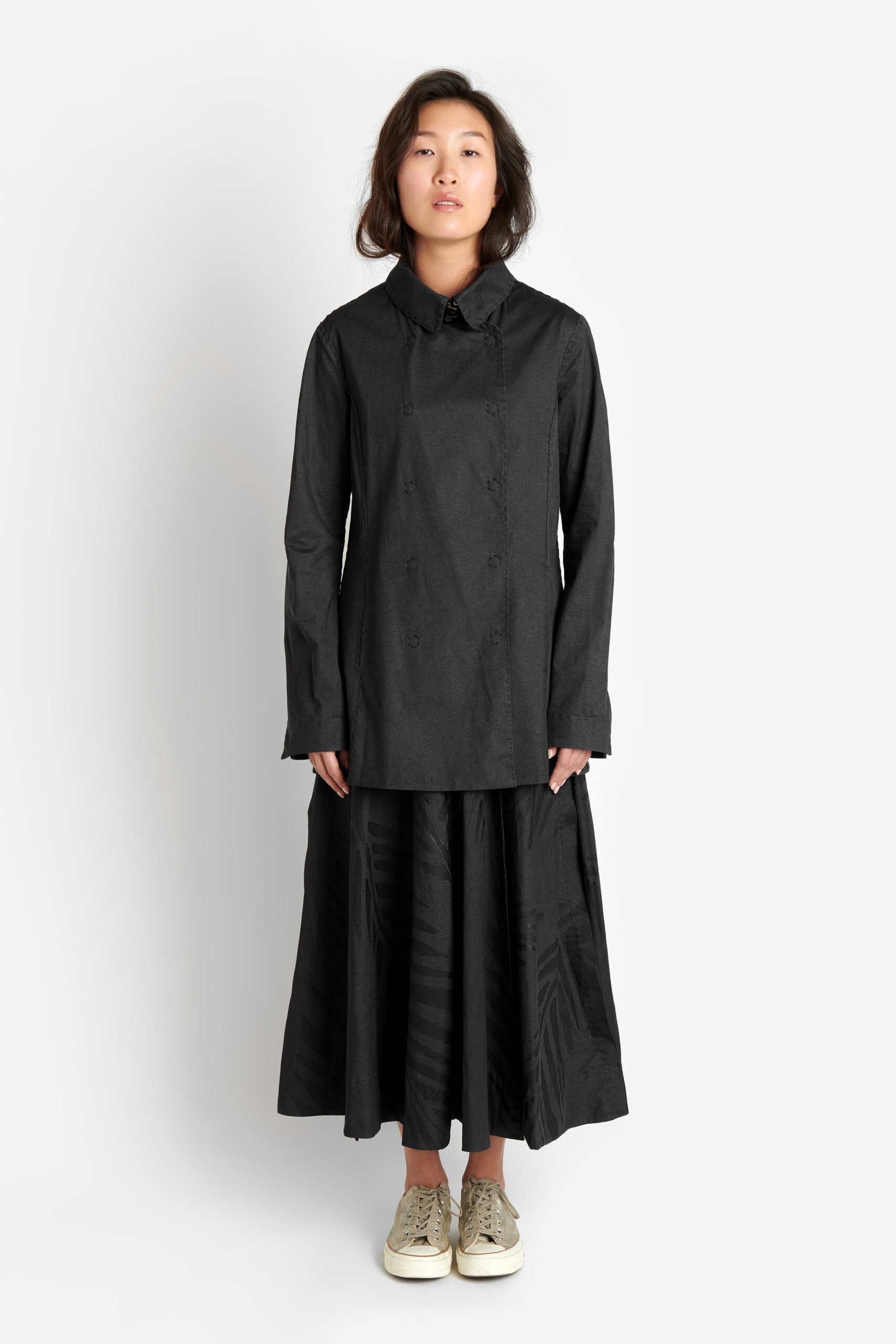 black relaxed coat and tiered skirt