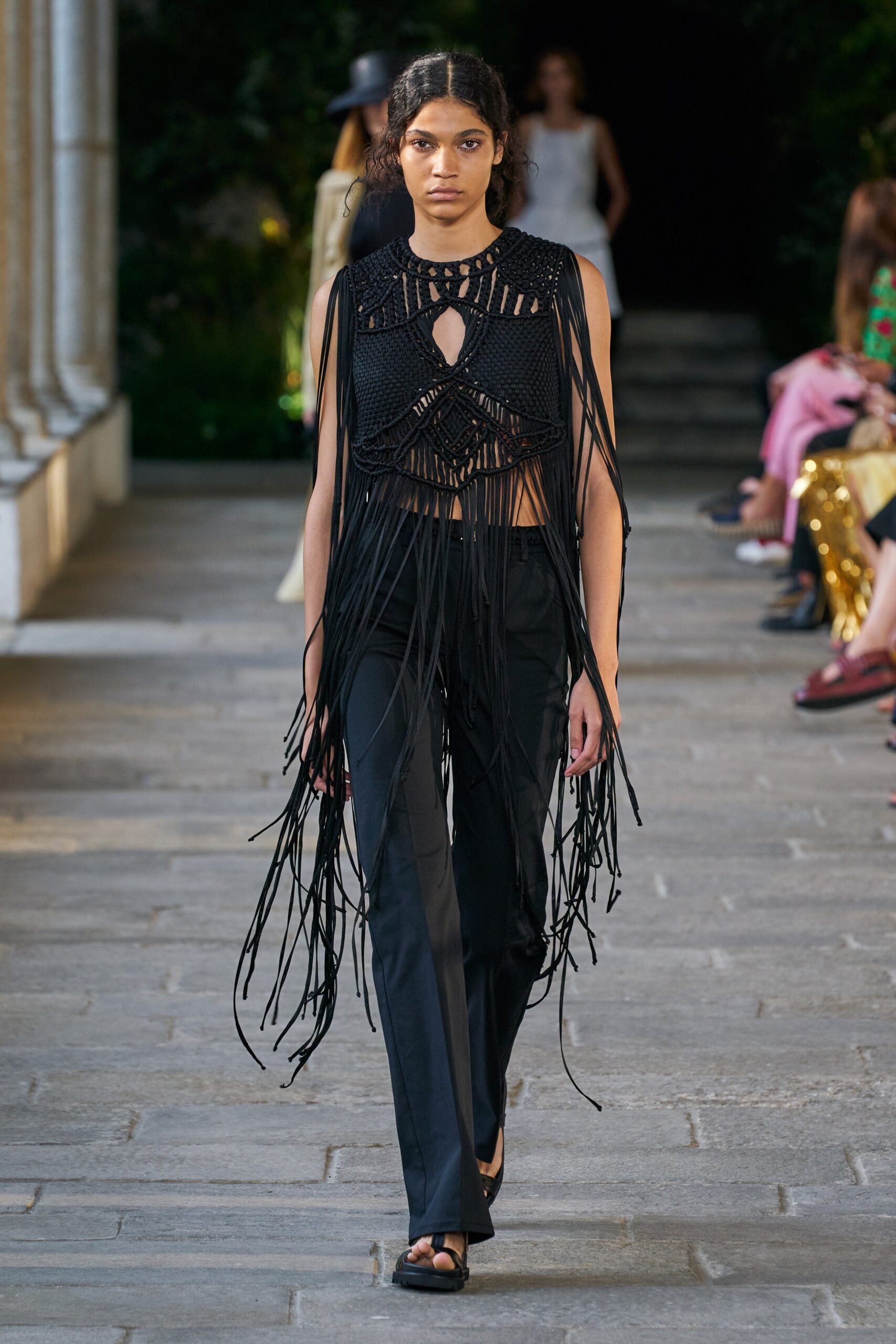 black fringed cropped top and slim pants