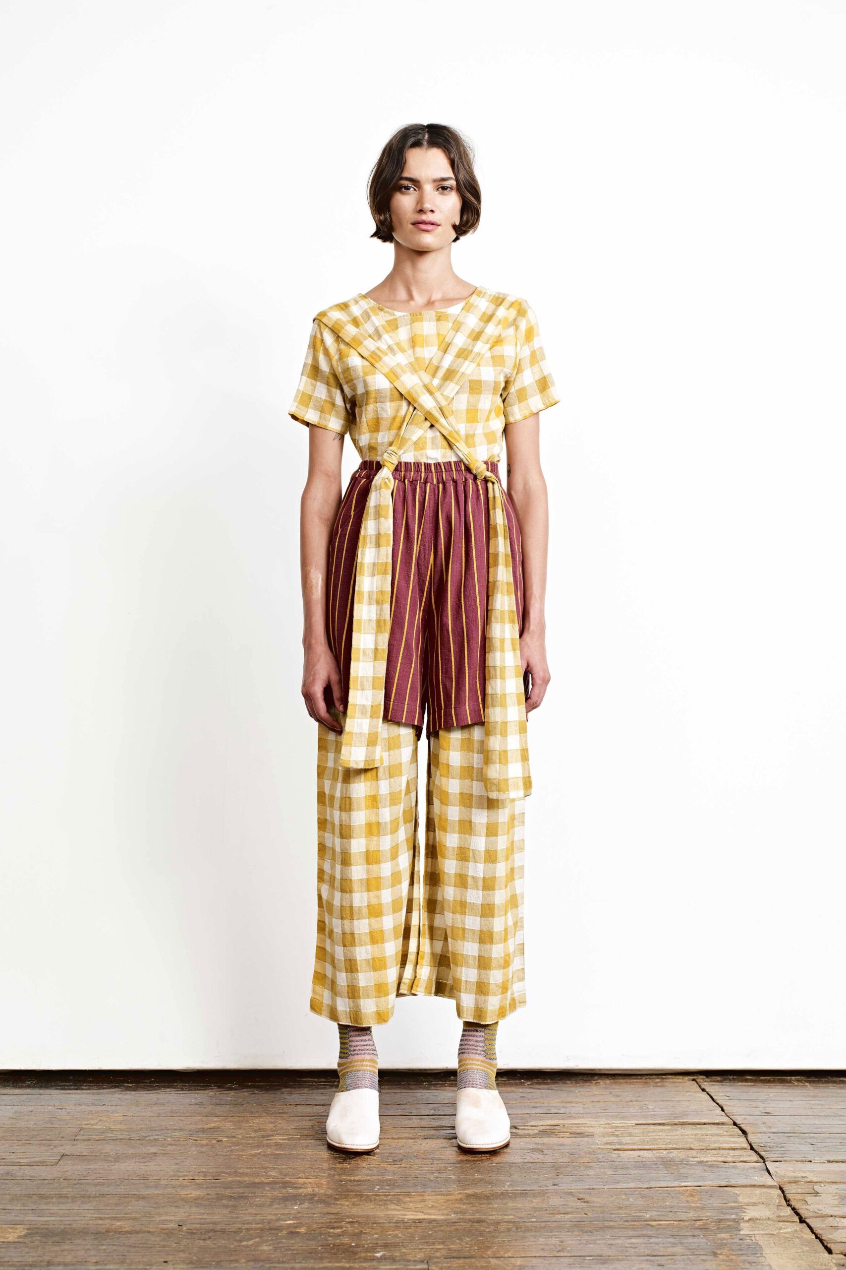 yellow checked top with maroon pants
