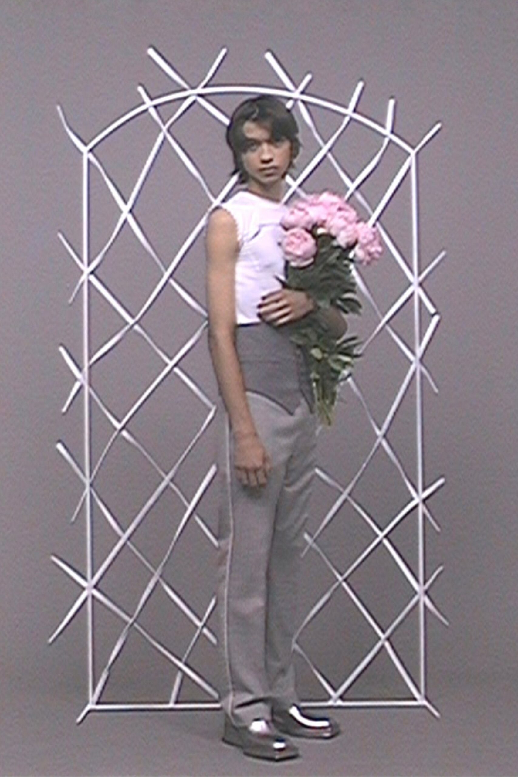 fitted white top with tailored gray pants