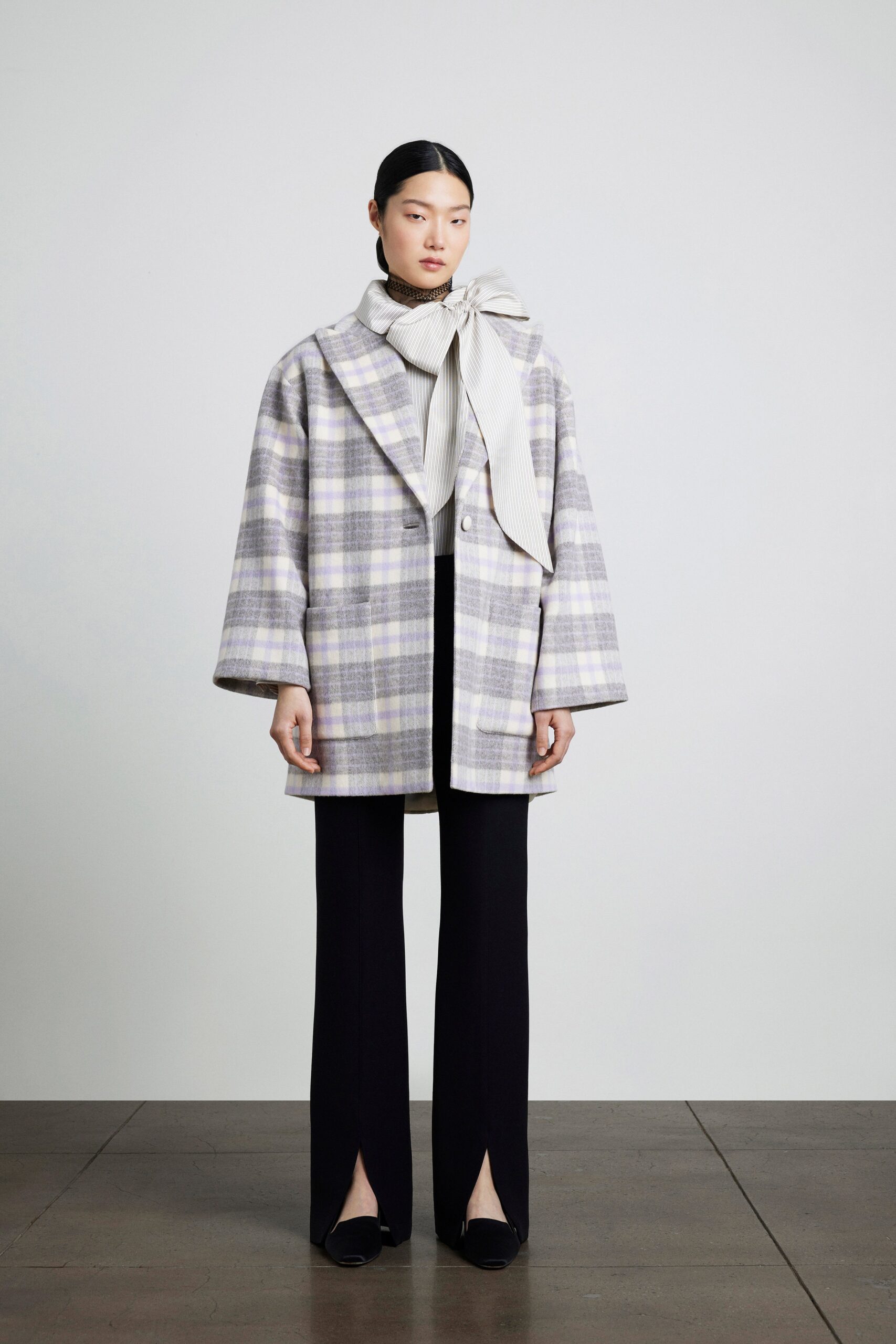 gray checked jacket with black pants