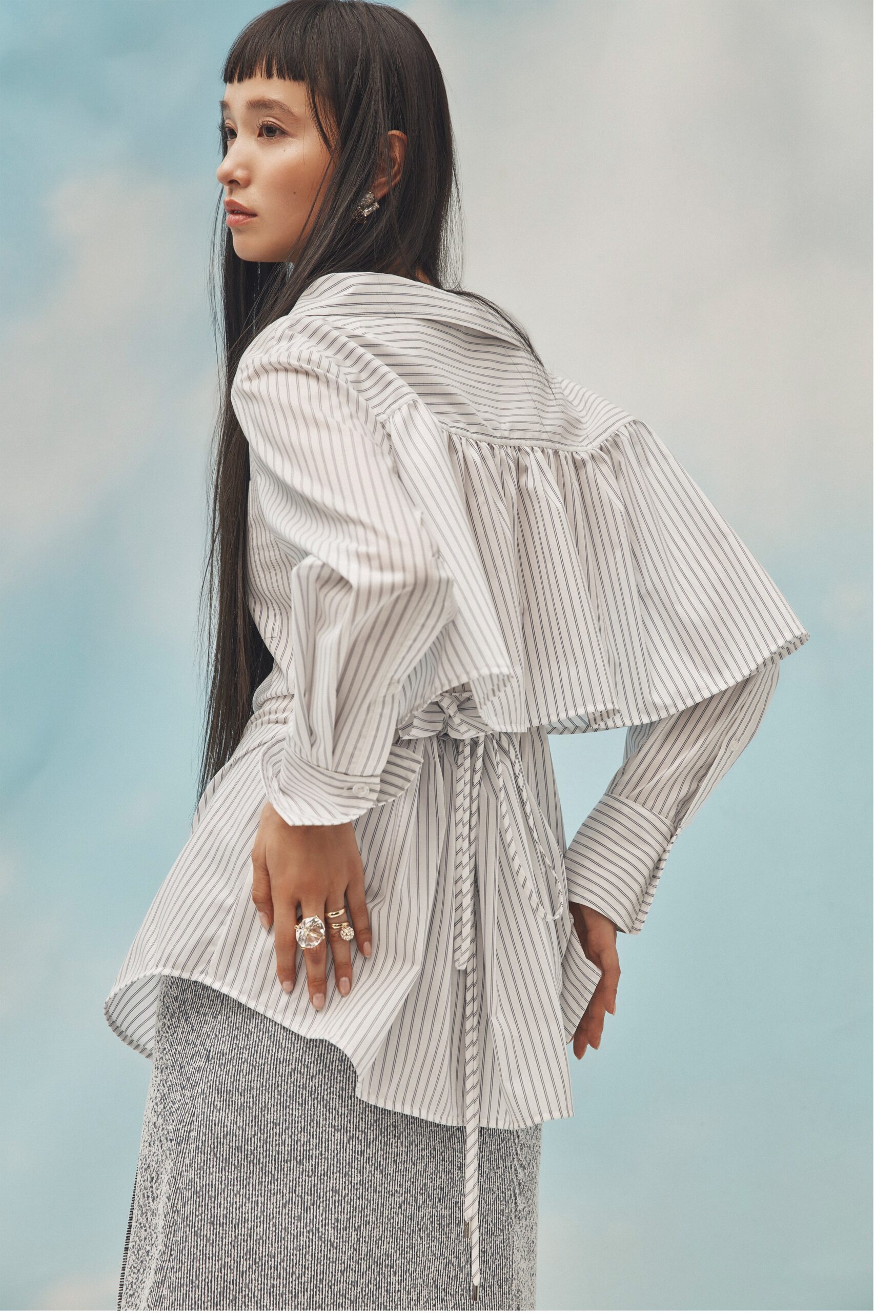 striped blouse and gray pencil skirt
