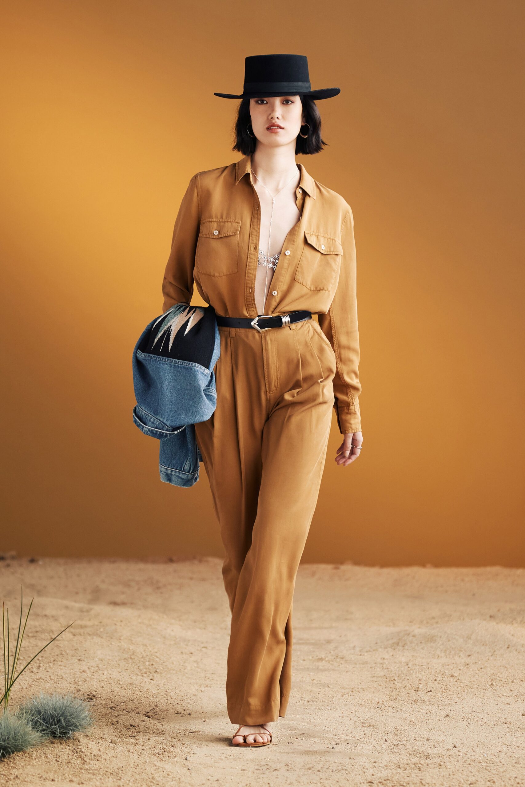 brown fitted jumpsuit with denim jacket
