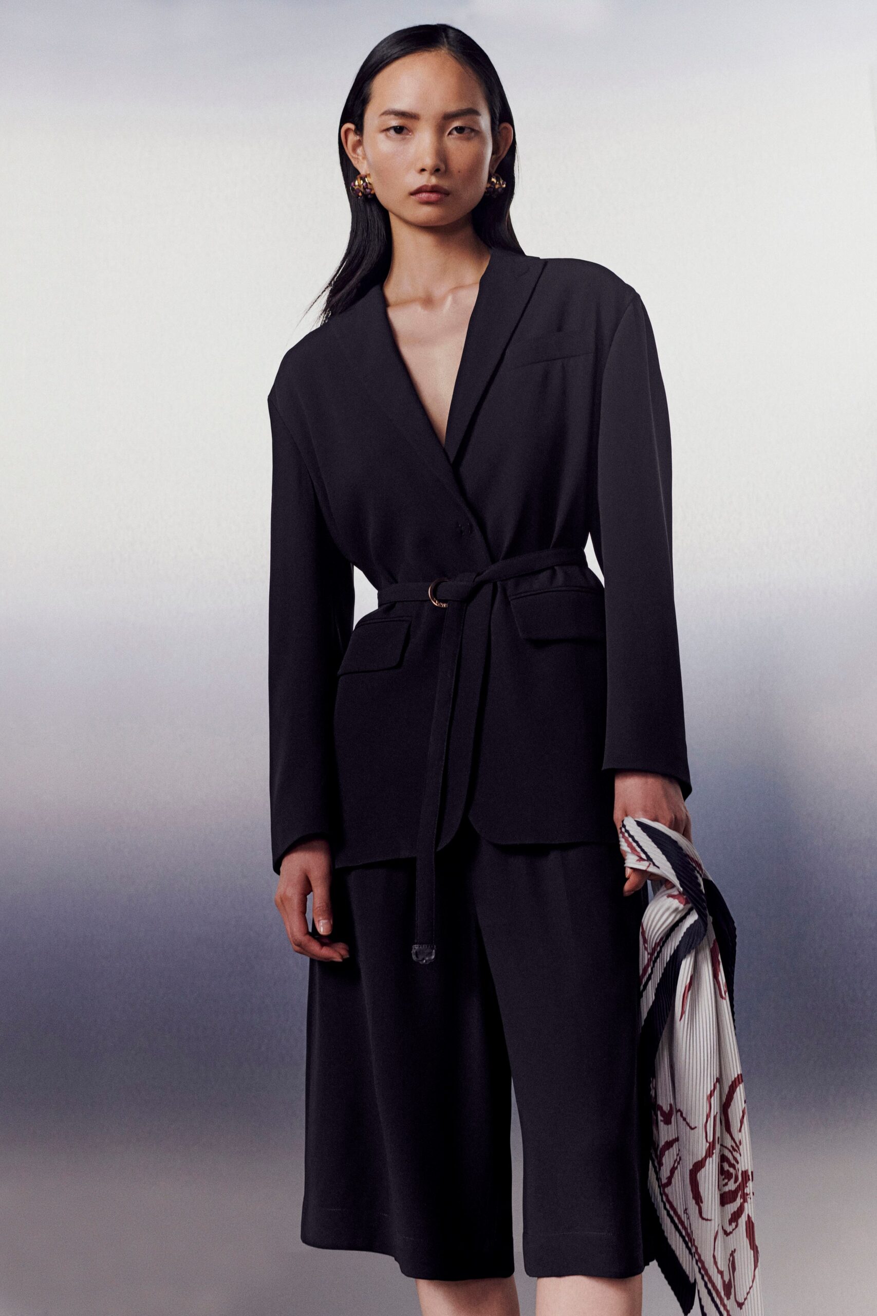 black tailored blazer and relaxed shorts