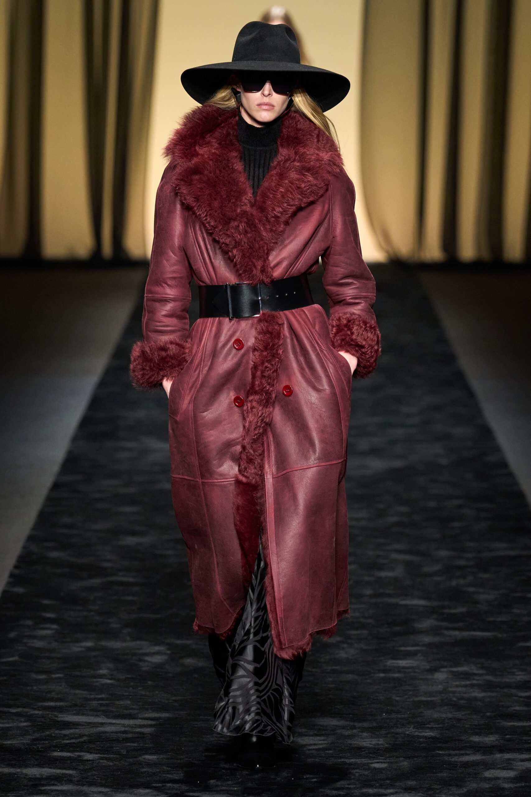 red leather long-sleeve collared fitted belted buttoned coat