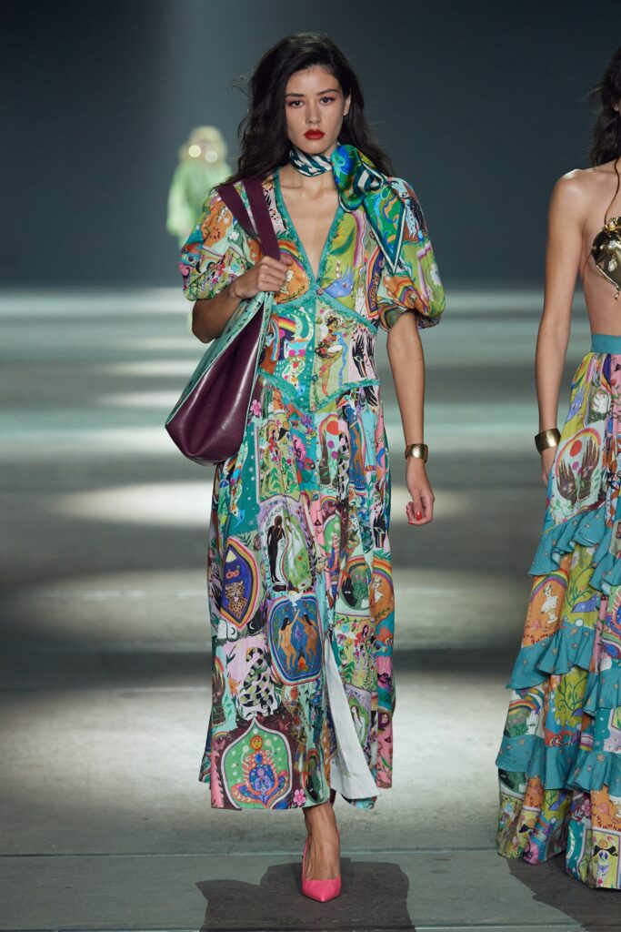 A relaxed multicolor dress with short sleeves and a V-neckline featuring a tiered design.
