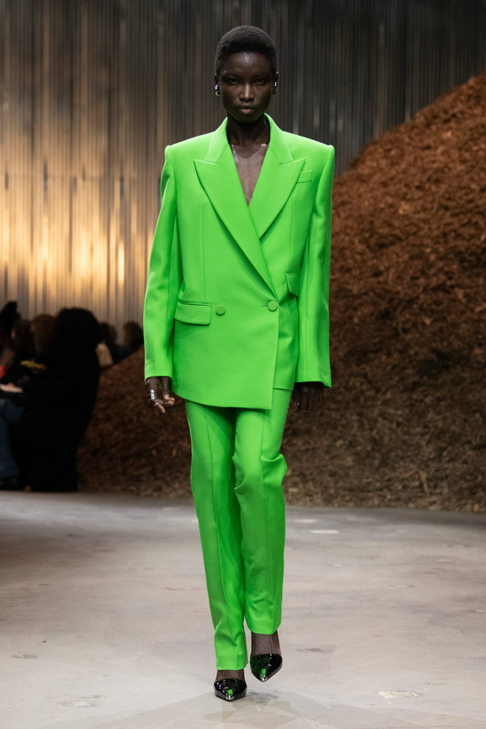 green tailored suit
