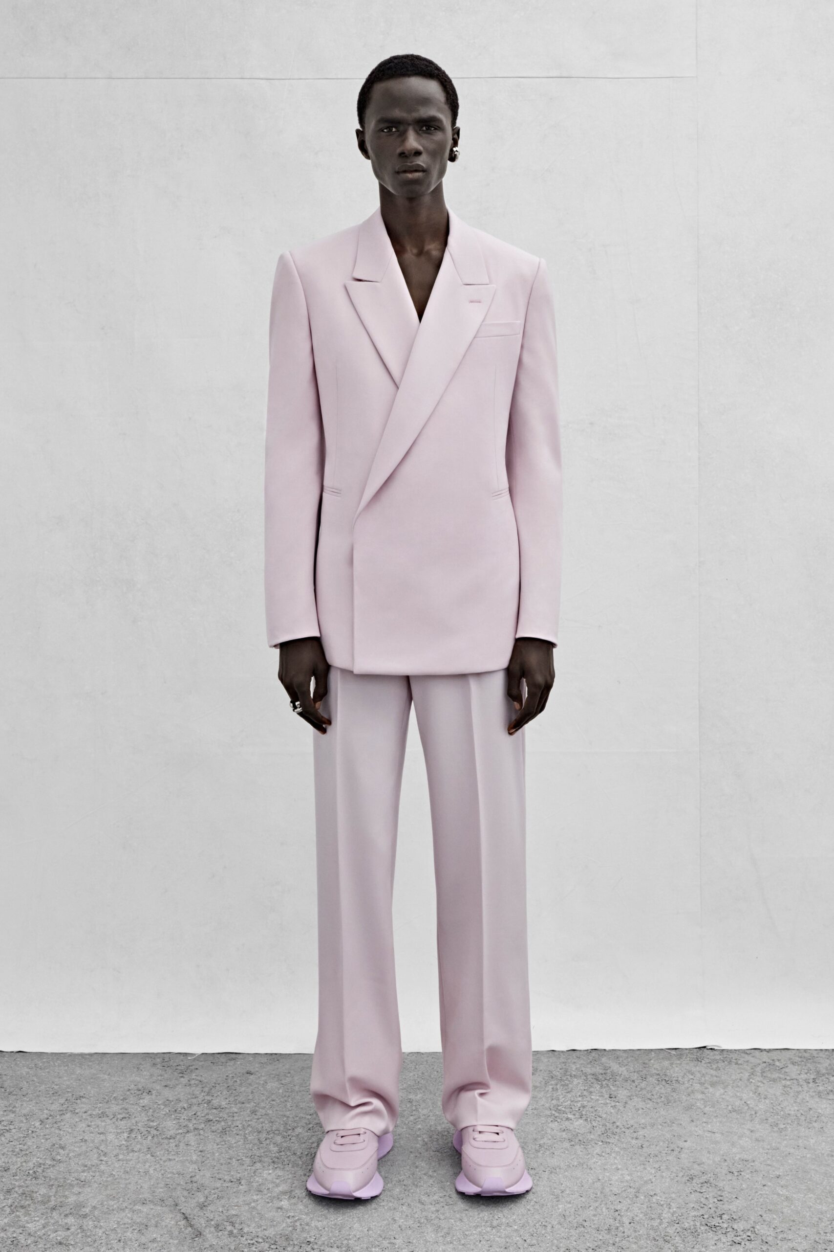 pink tailored suit with purple shoes