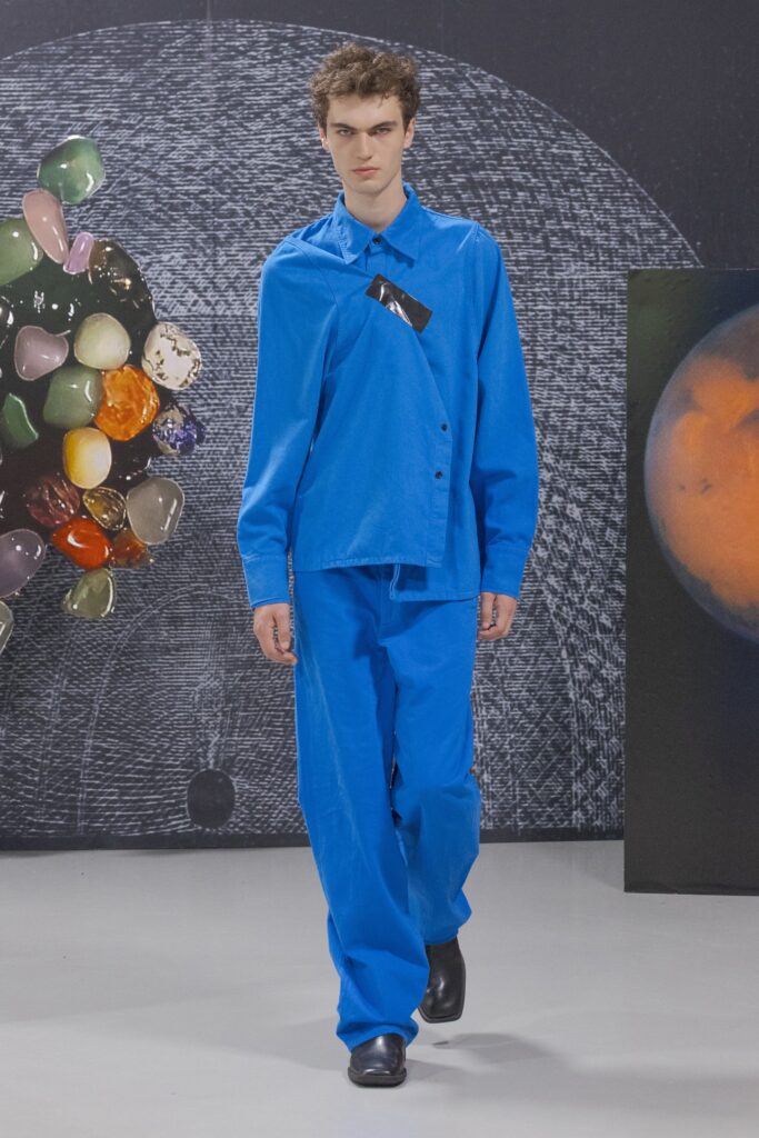 A relaxed blue cotton shirt with long sleeves and collared design paired with matching pants.