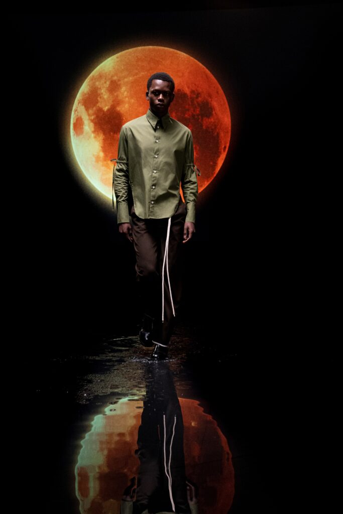 fitted green shirt and relaxed brown pants