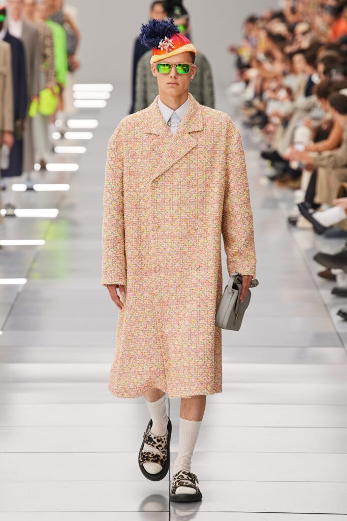 An oversized multicolor tweed coat with long sleeves and a collared design.
