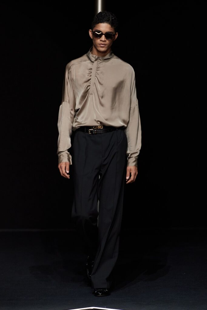 beige silk relaxed shirt and black tailored pants
