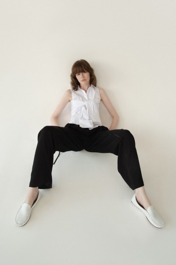 white fitted top black relaxed pants