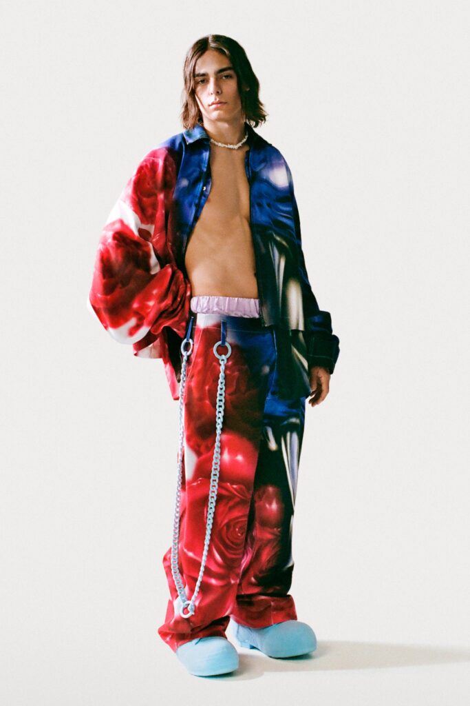 An oversized shirt and pants featuring a vibrant red and blue floral print.