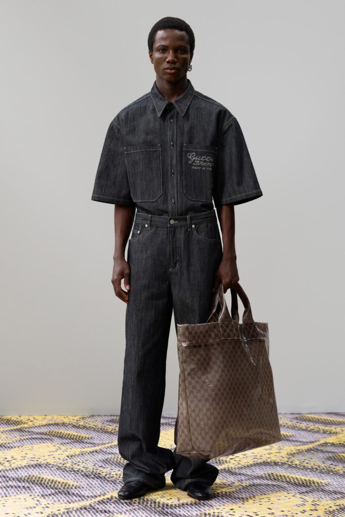 A relaxed-fit blue denim shirt with short sleeves and straight-leg pants.