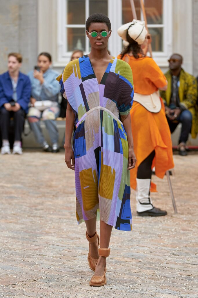 A relaxed multicolor dress with a V-neckline and asymmetric design details.