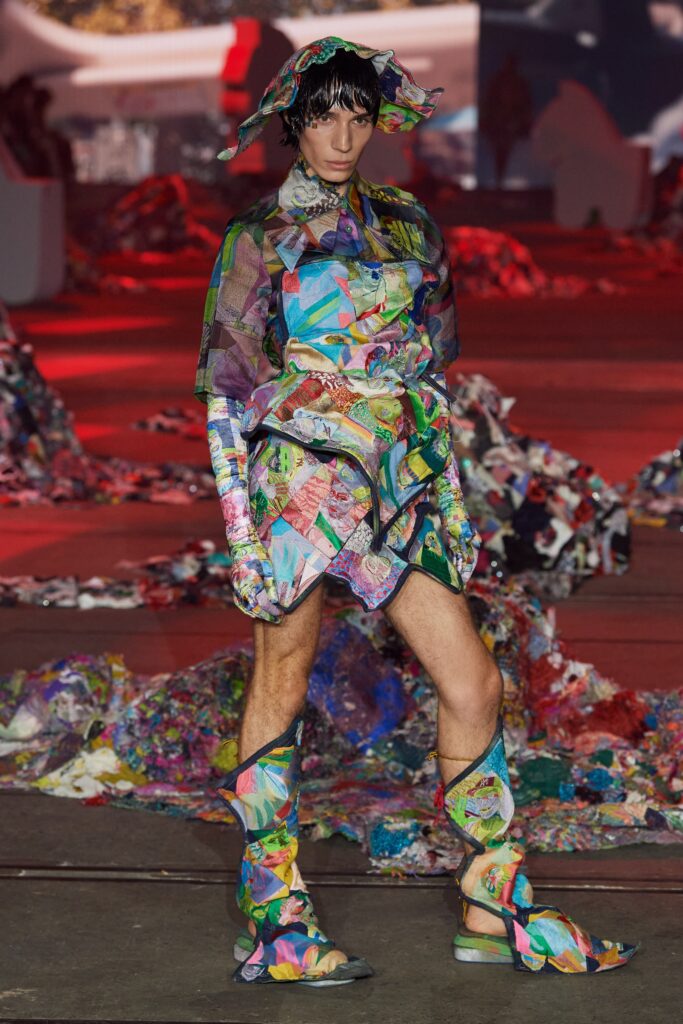 A relaxed multicolor sleeveless dress with a collared design and asymmetric details.