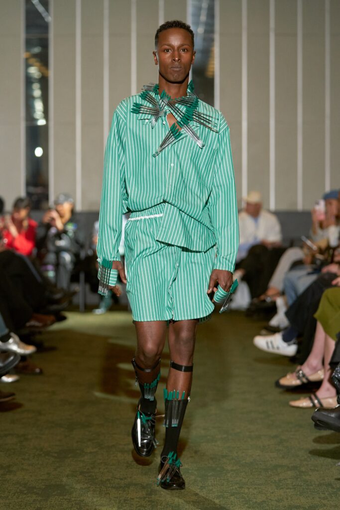 A relaxed fit green and white striped shirt with long sleeves and matching shorts.