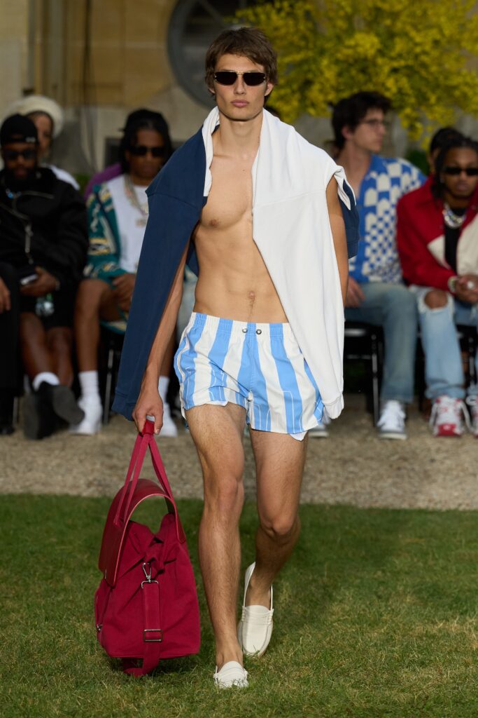 A fitted blue and white striped sleeveless top paired with matching shorts.