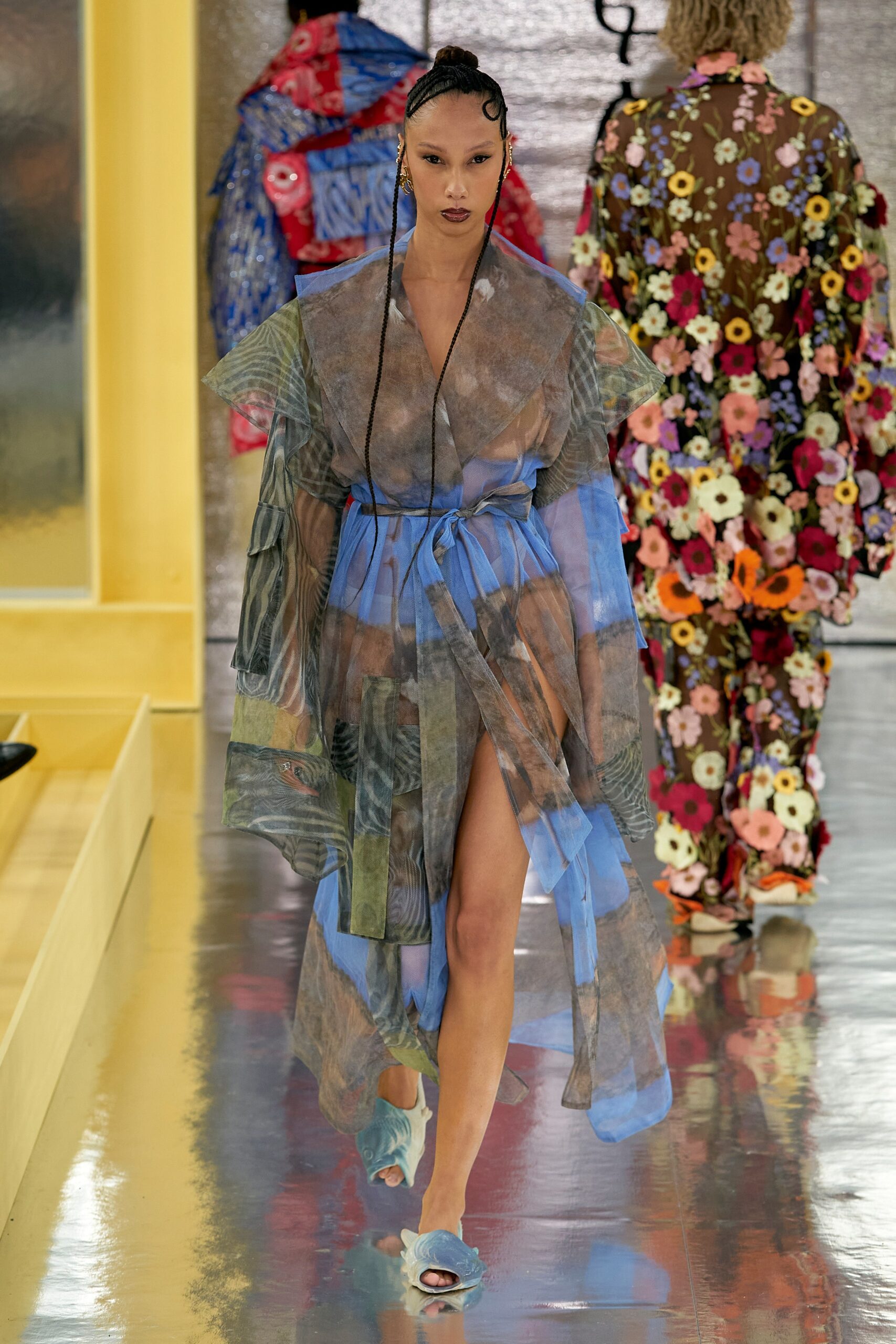 A relaxed blue silk sleeveless dress with a V-neckline and asymmetric tiered design.