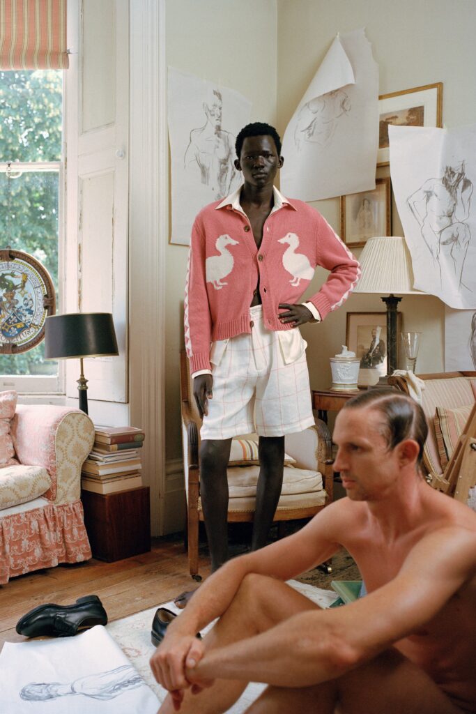 pink cardigan and white shorts