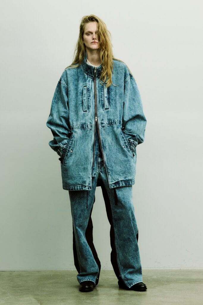 An oversized blue denim jacket paired with matching denim pants for a relaxed look.
