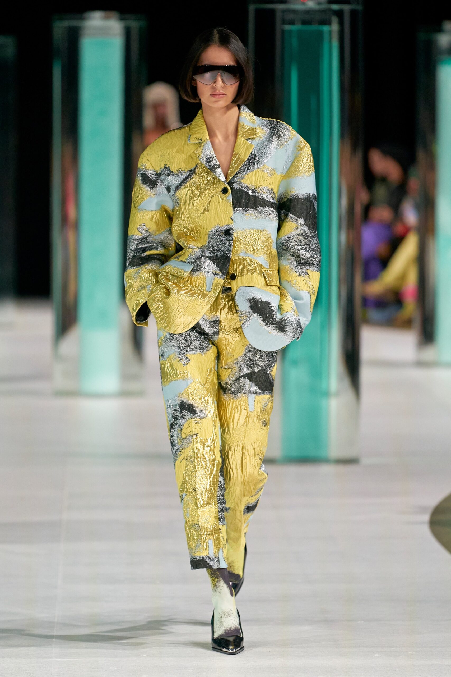A relaxed fit yellow jacket with a printed design, paired with matching pants.