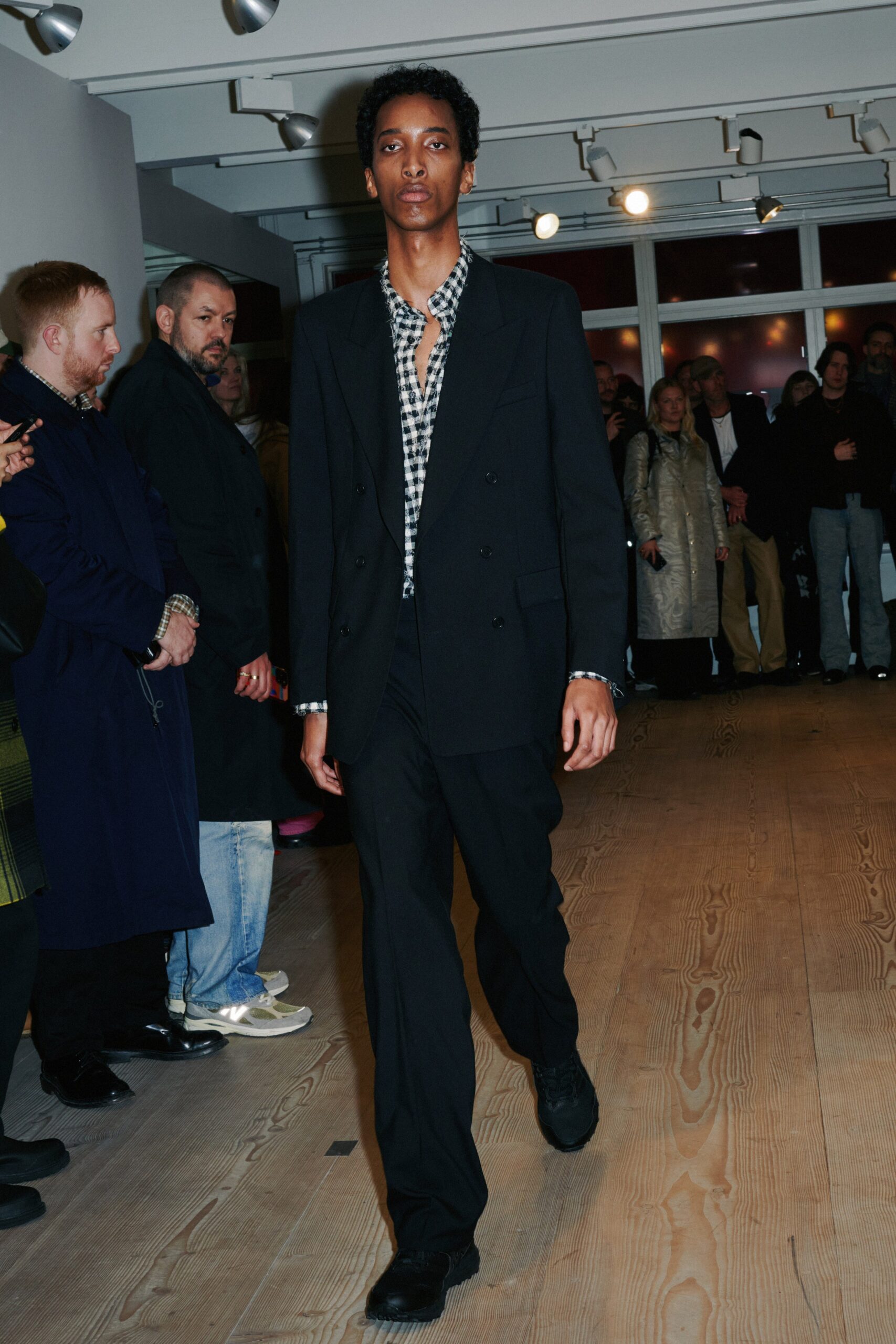 black tailored suit with checked shirt