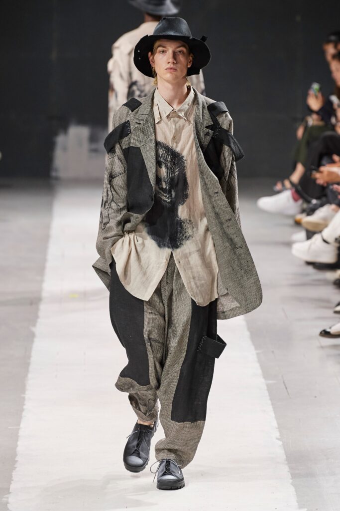 A relaxed gray jacket with long sleeves and collared design paired with matching pants.