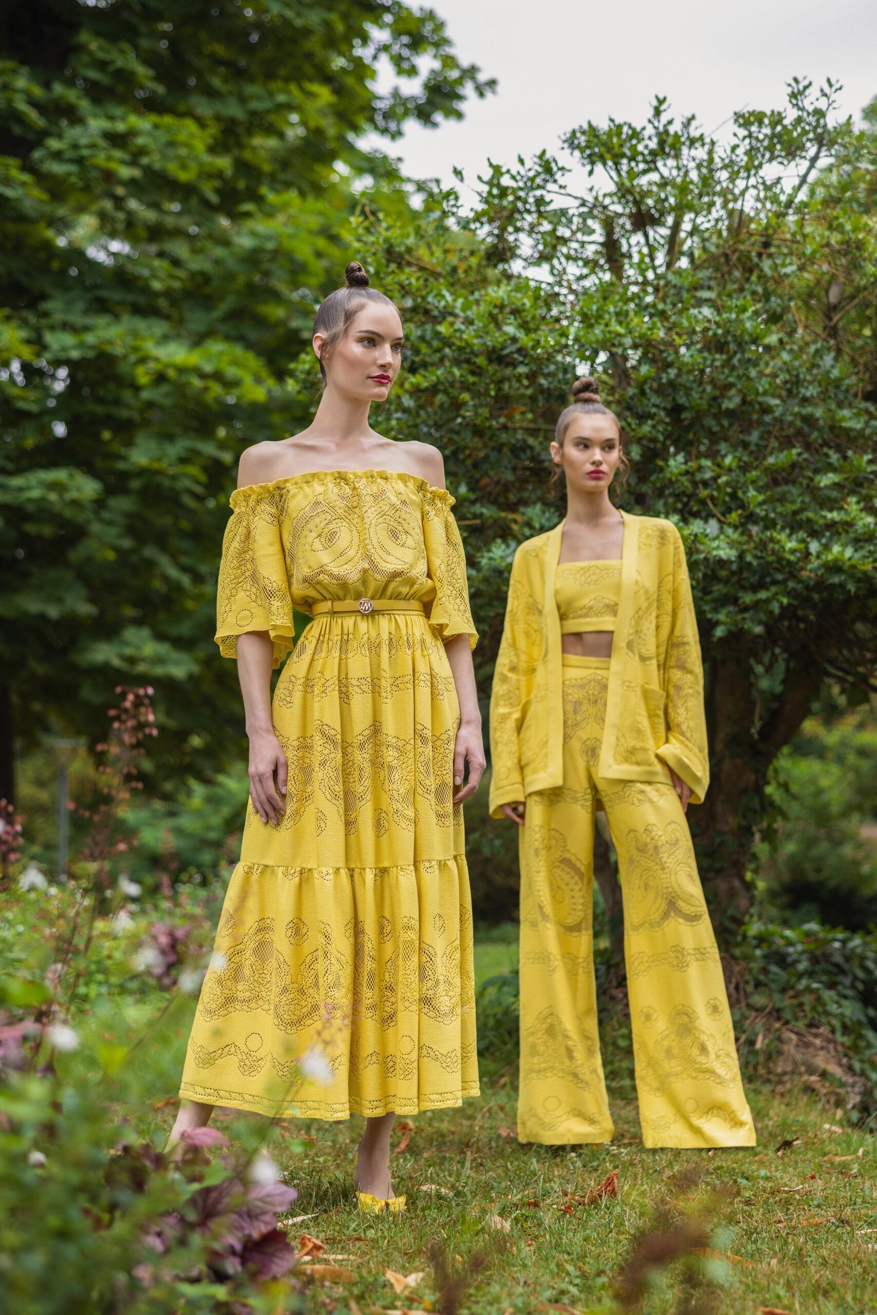 A relaxed yellow printed off-shoulder dress with a tiered design.