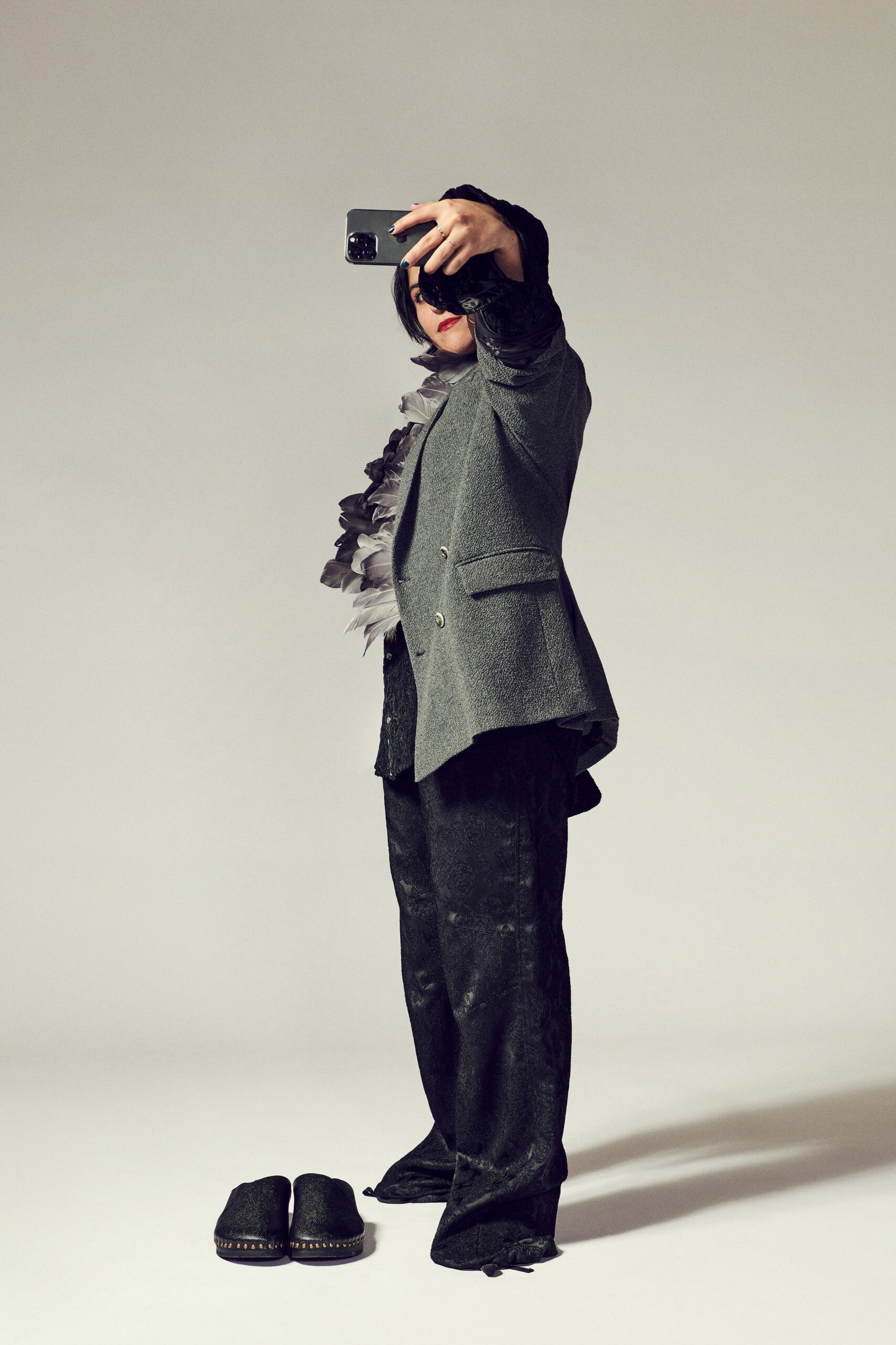 gray blazer black shirt relaxed pants