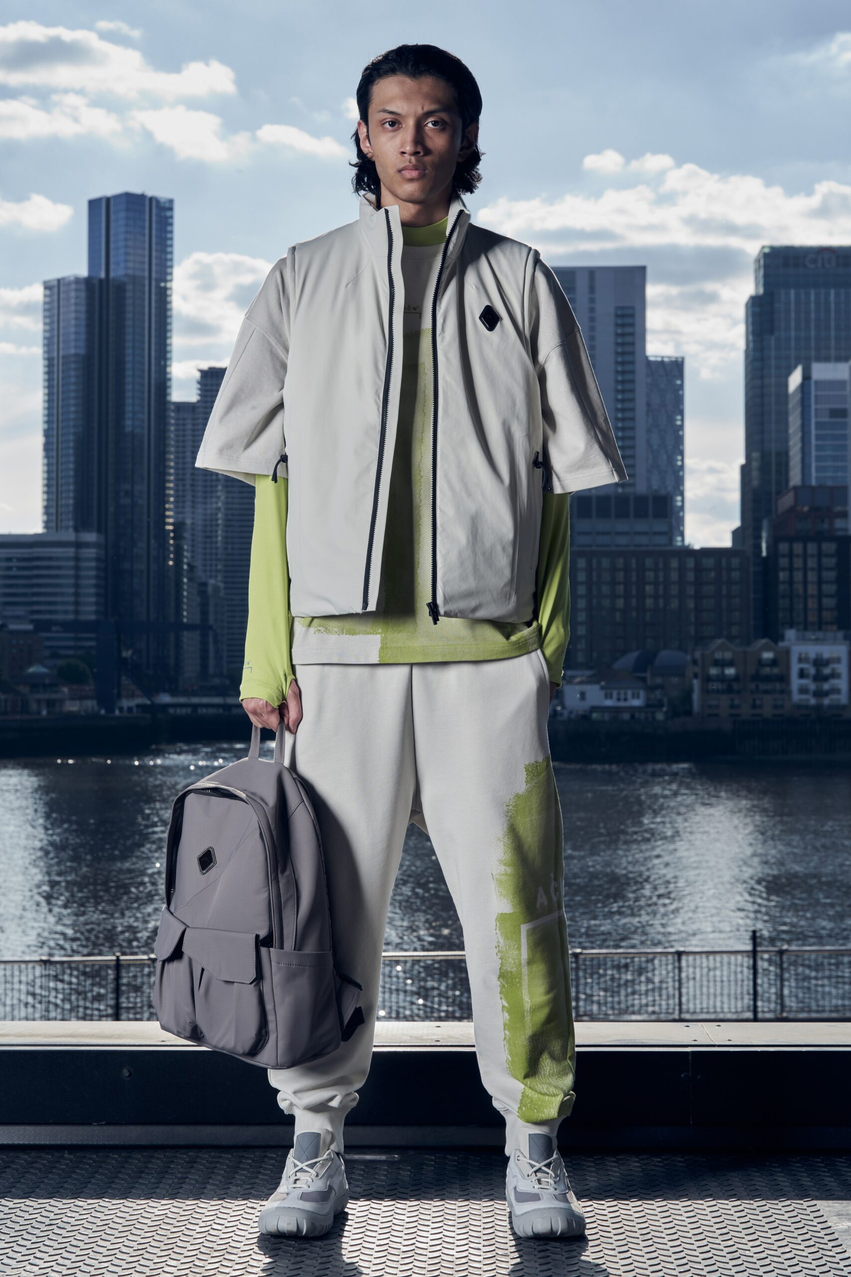 A relaxed gray jacket with short sleeves and matching printed pants in green tones.