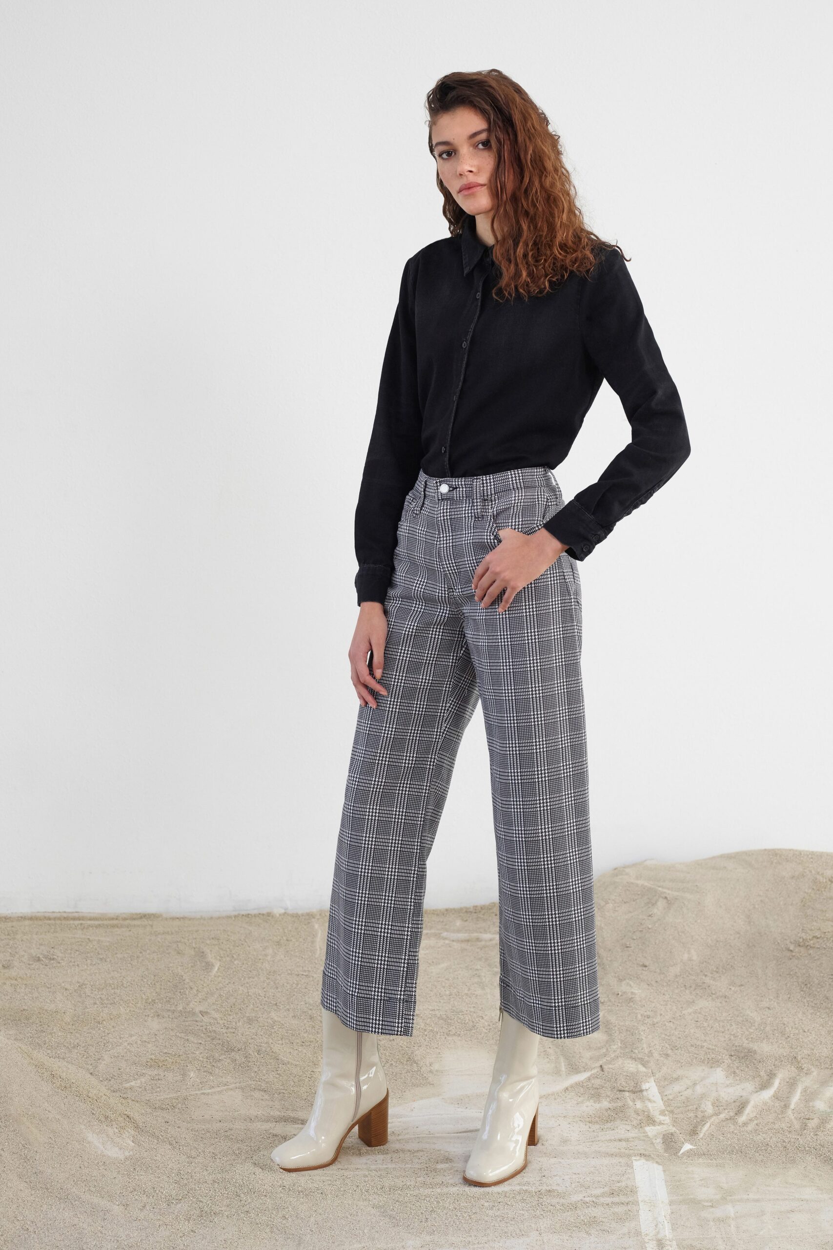 black shirt gray checked pants