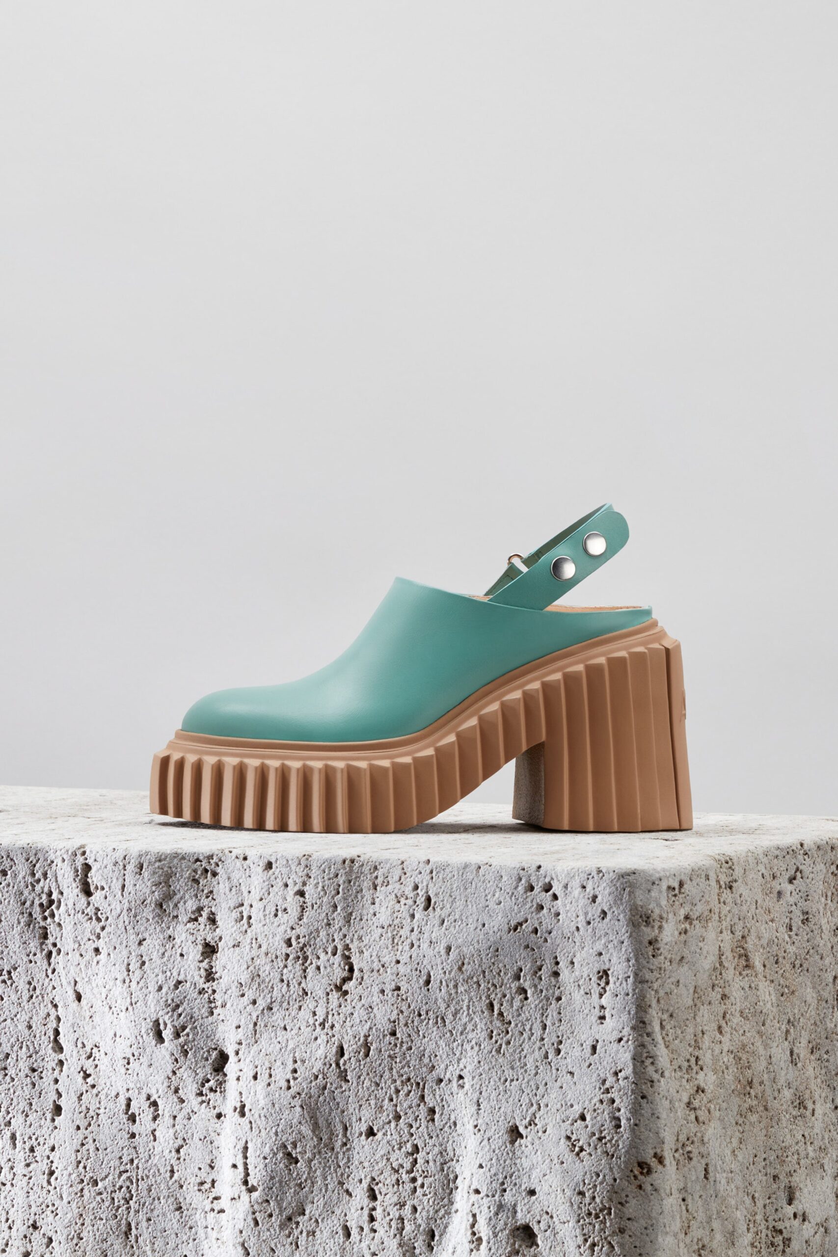 teal vinyl shoes with brown heel
