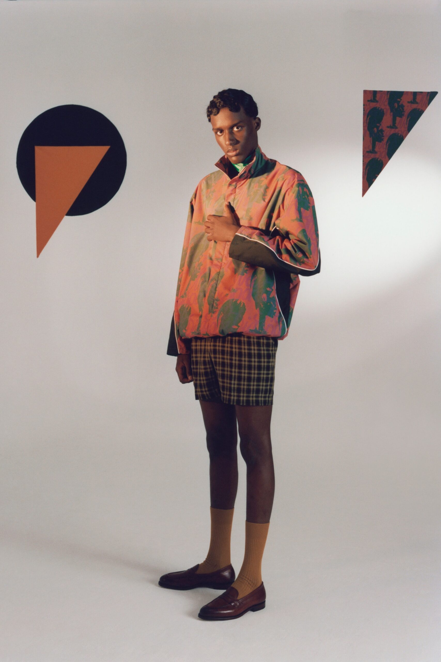 multi-colored relaxed jacket and checked shorts
