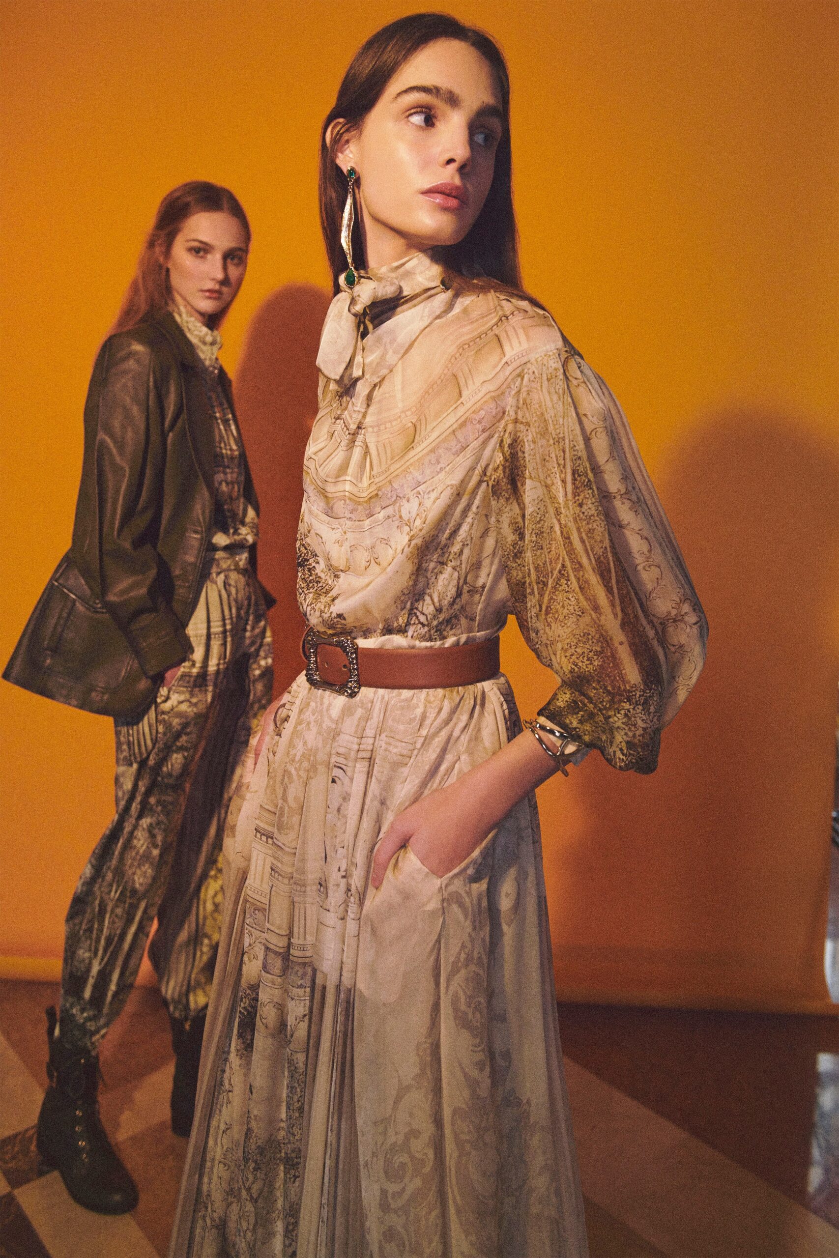 beige printed maxi dress and black leather jacket