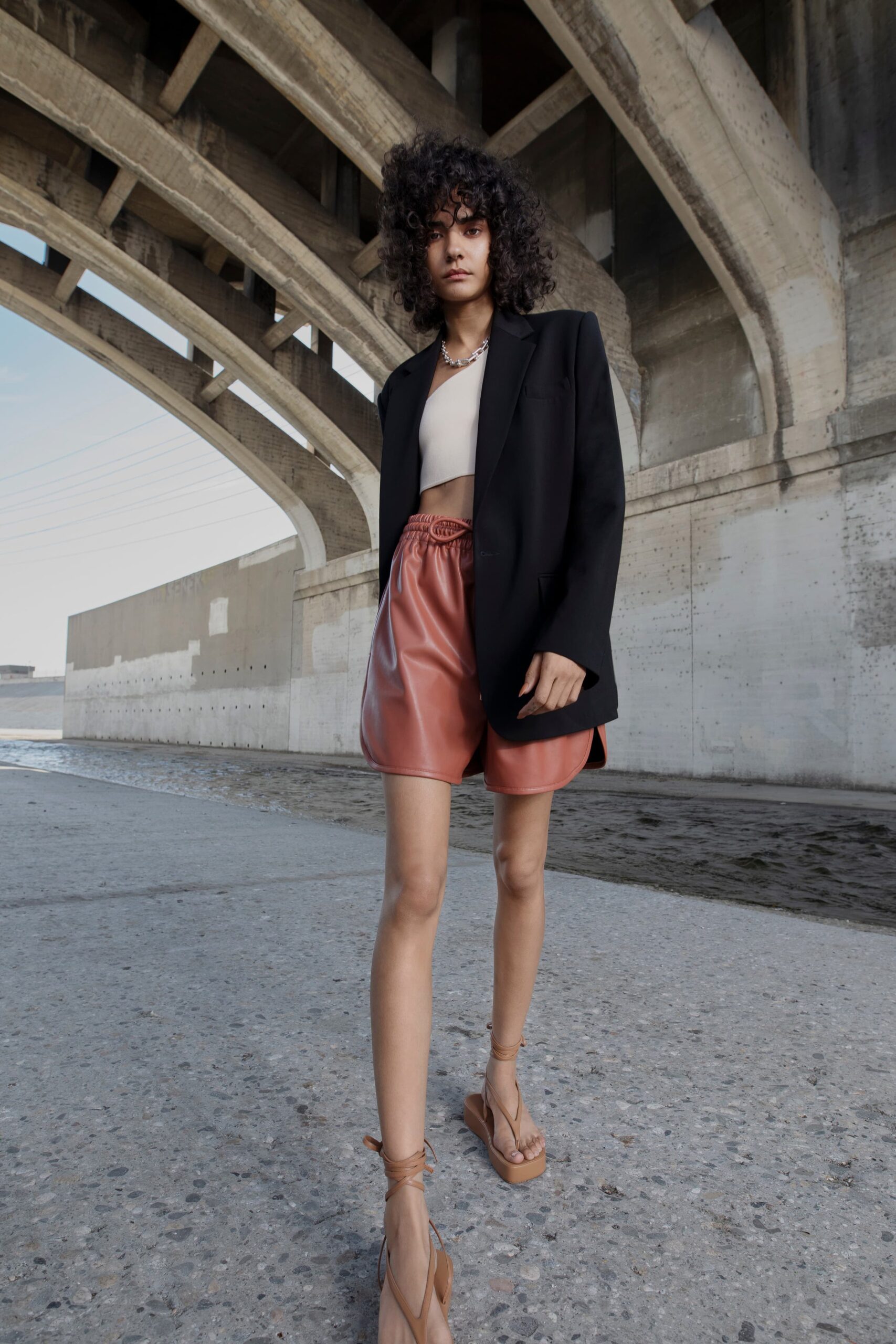 oversized black blazer with leather shorts
