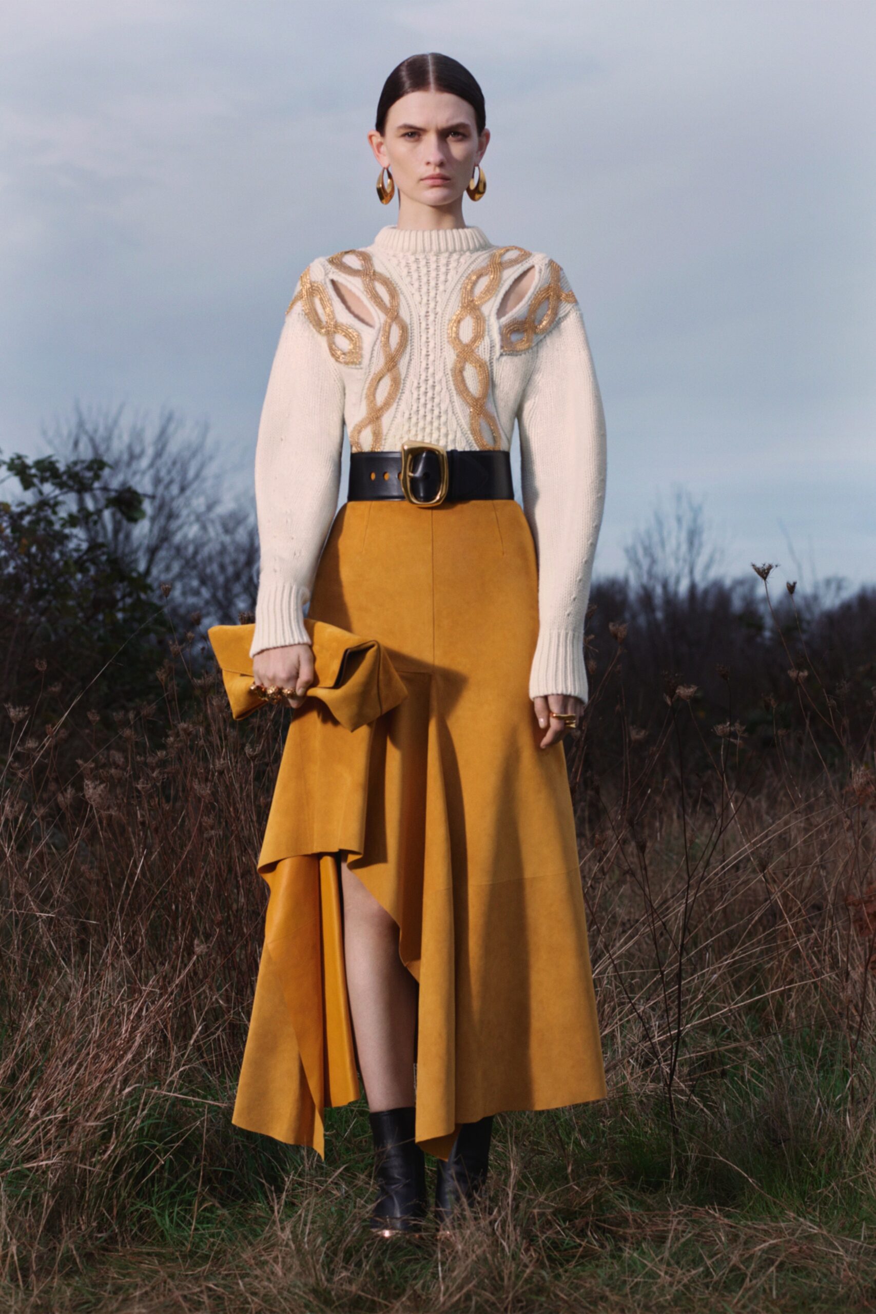white wool fitted sweater and yellow suede skirt