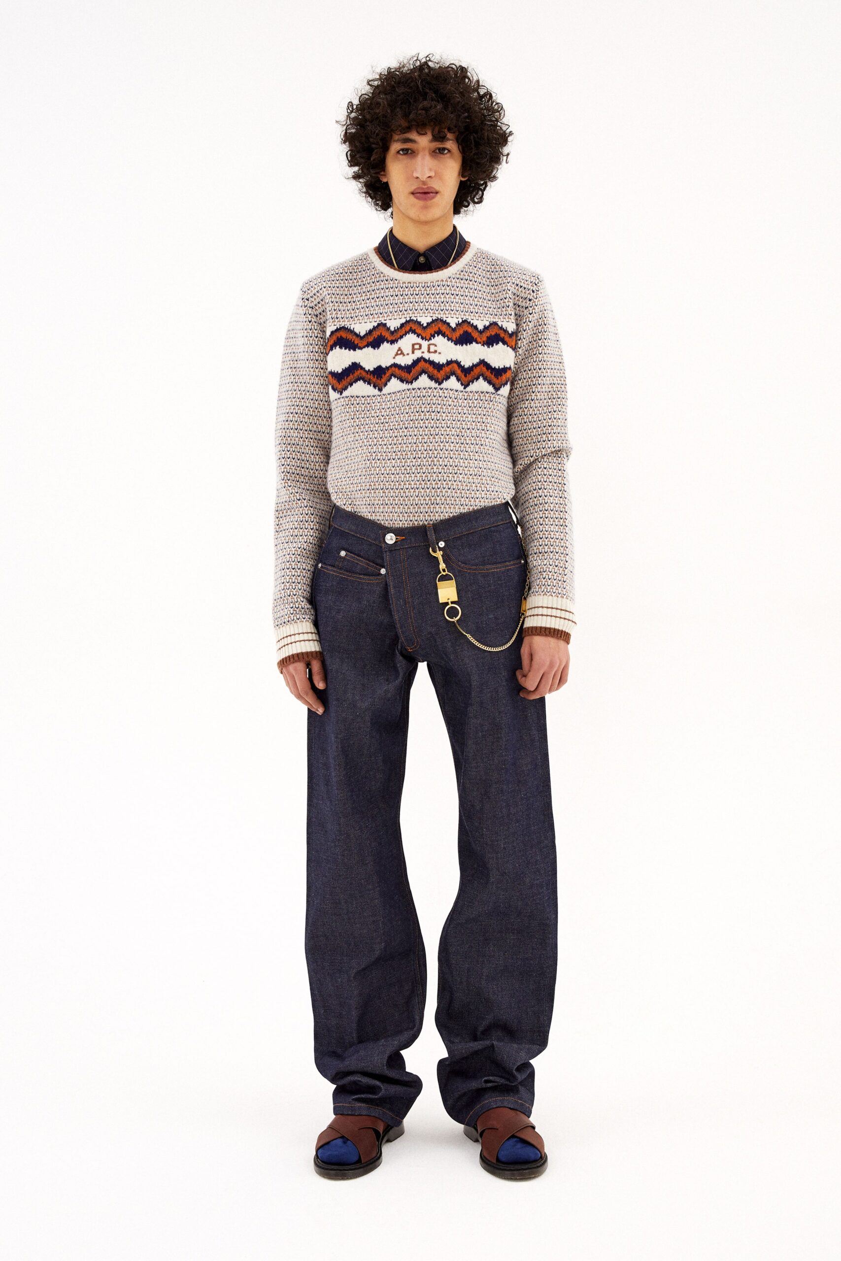 gray striped relaxed sweater and blue jeans