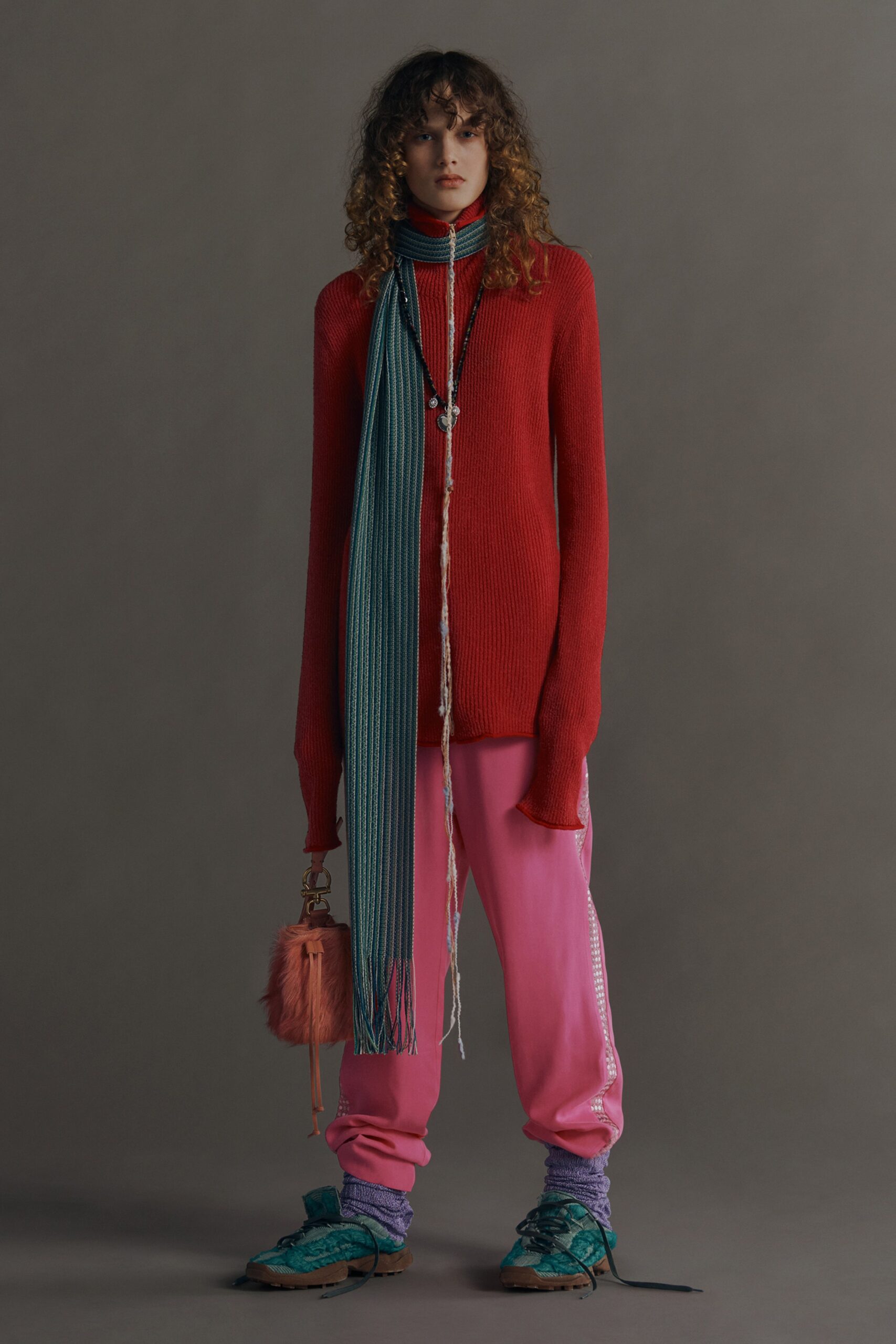 red wool fitted sweater with pink pants