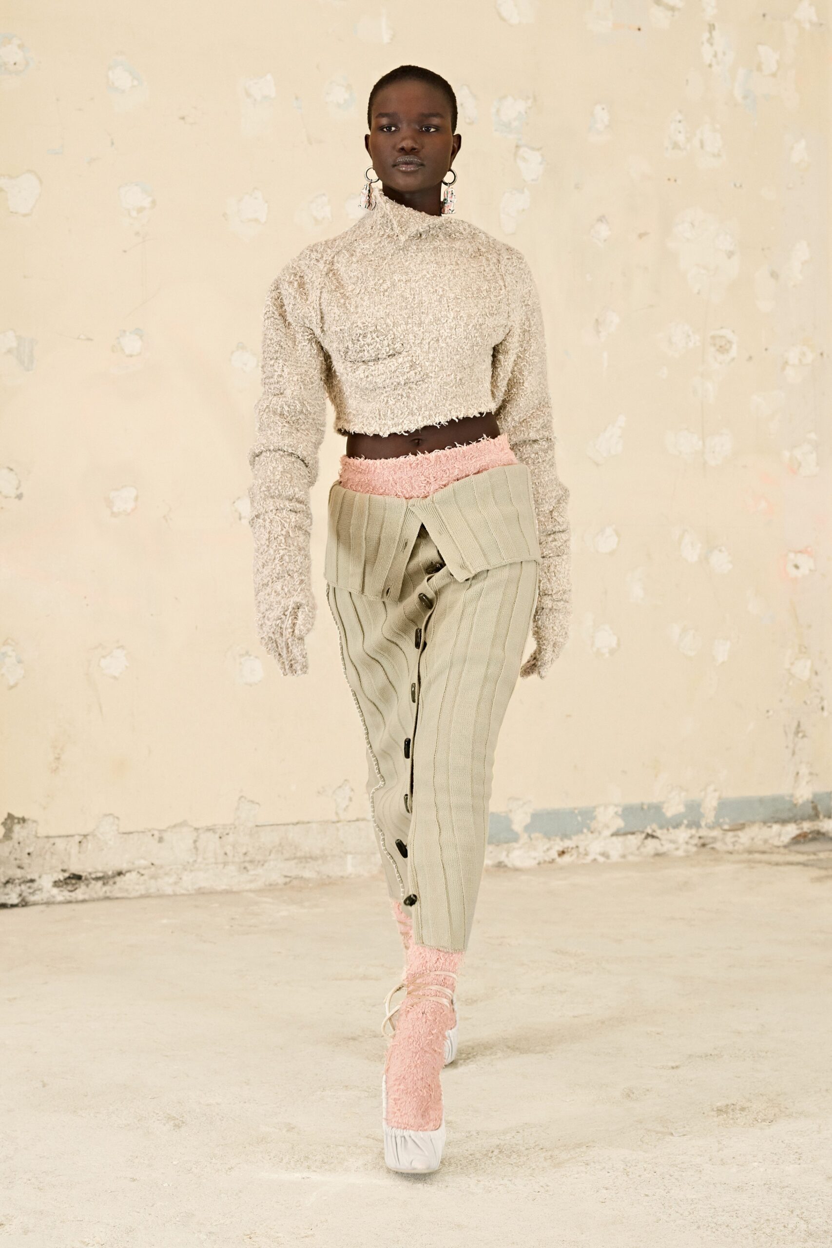 beige cropped top with gray tailored pants