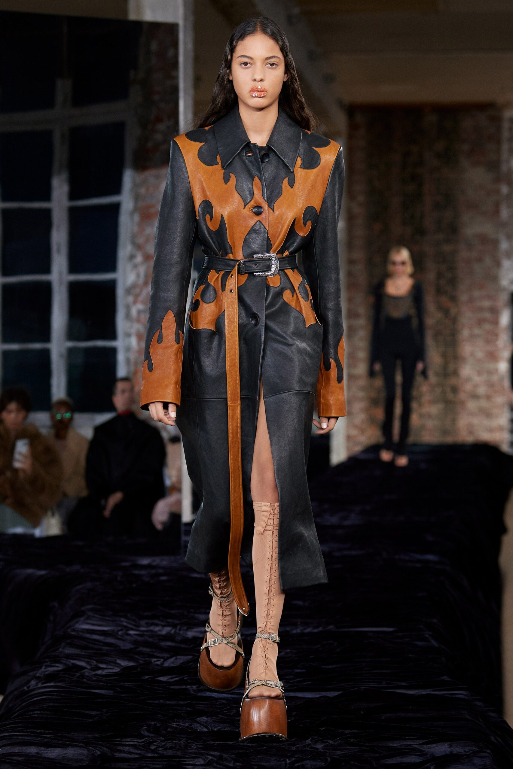 black and brown leather coat