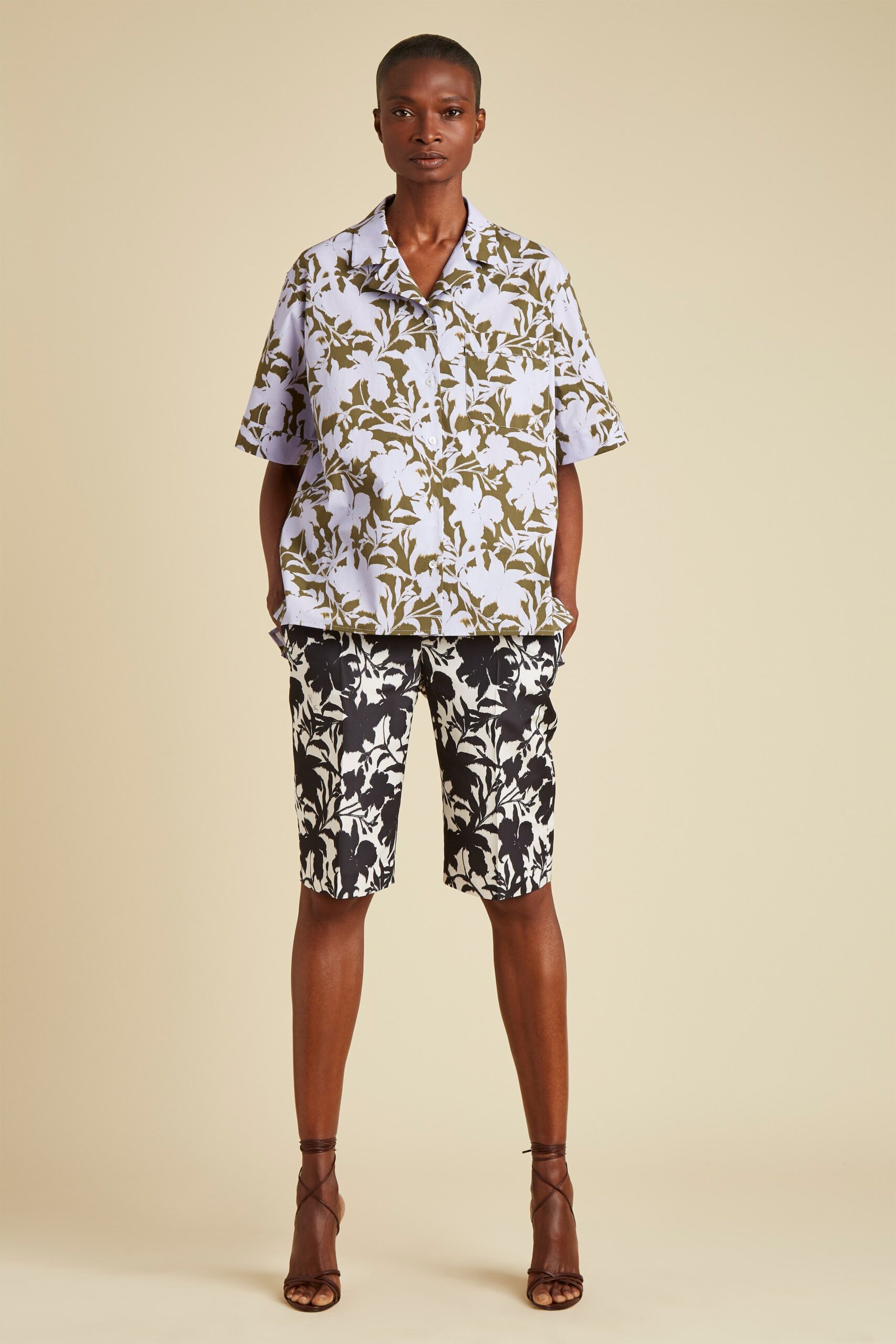lavender printed shirt and black shorts