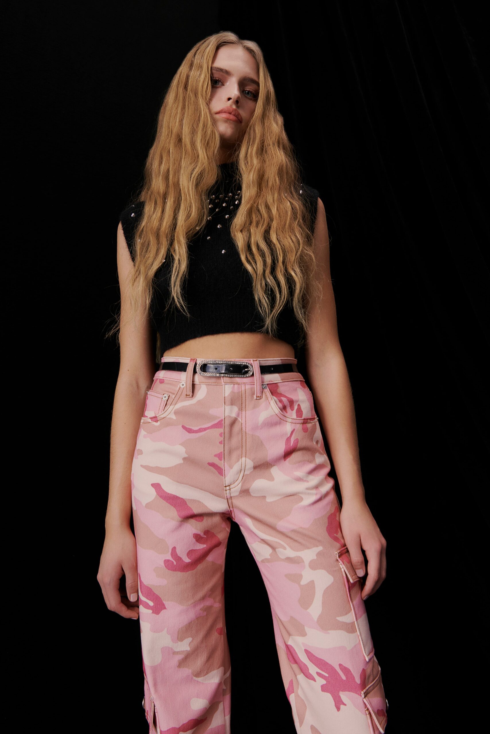 black fitted top with pink cargo pants