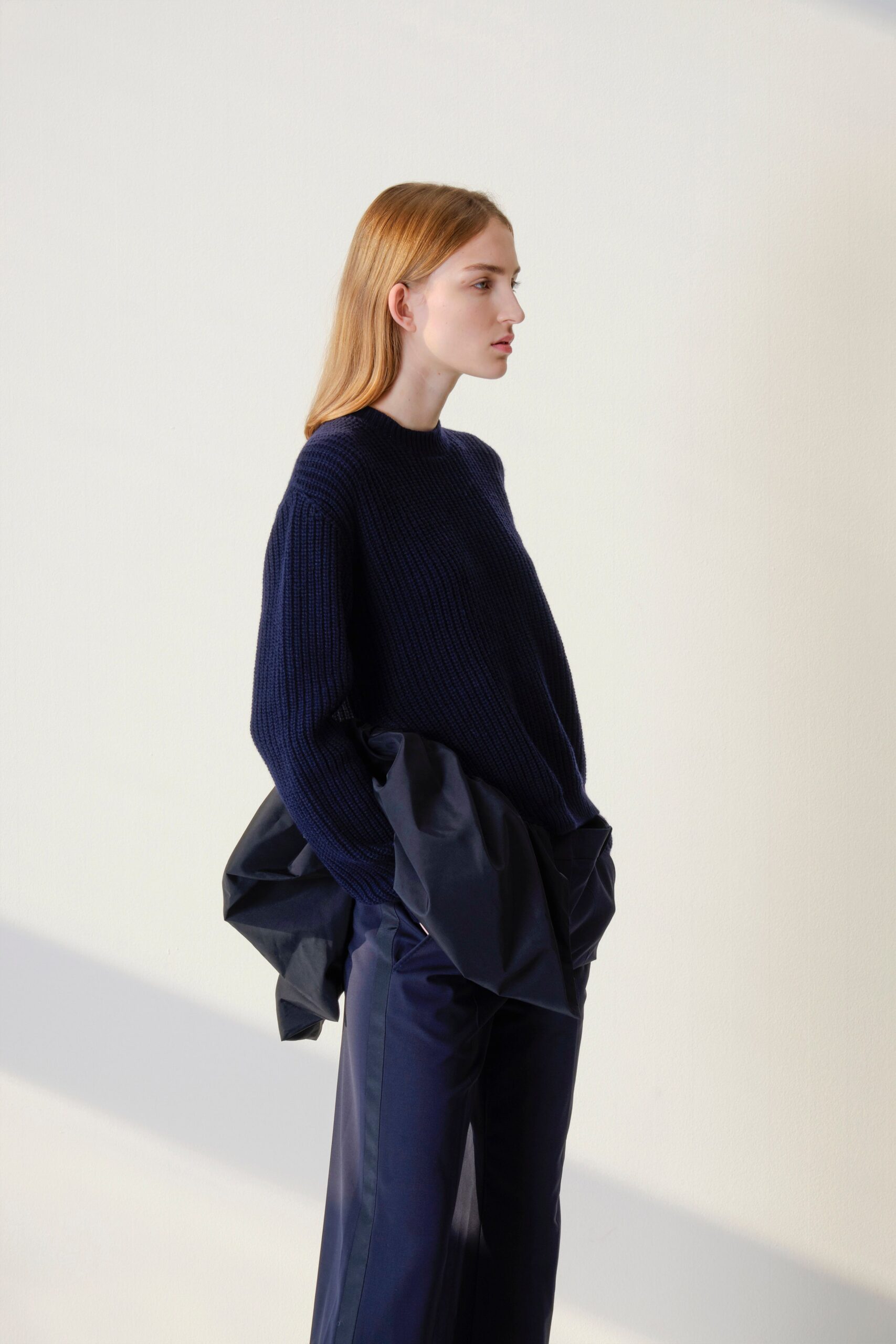 navy wool relaxed sweater and black tailored pants