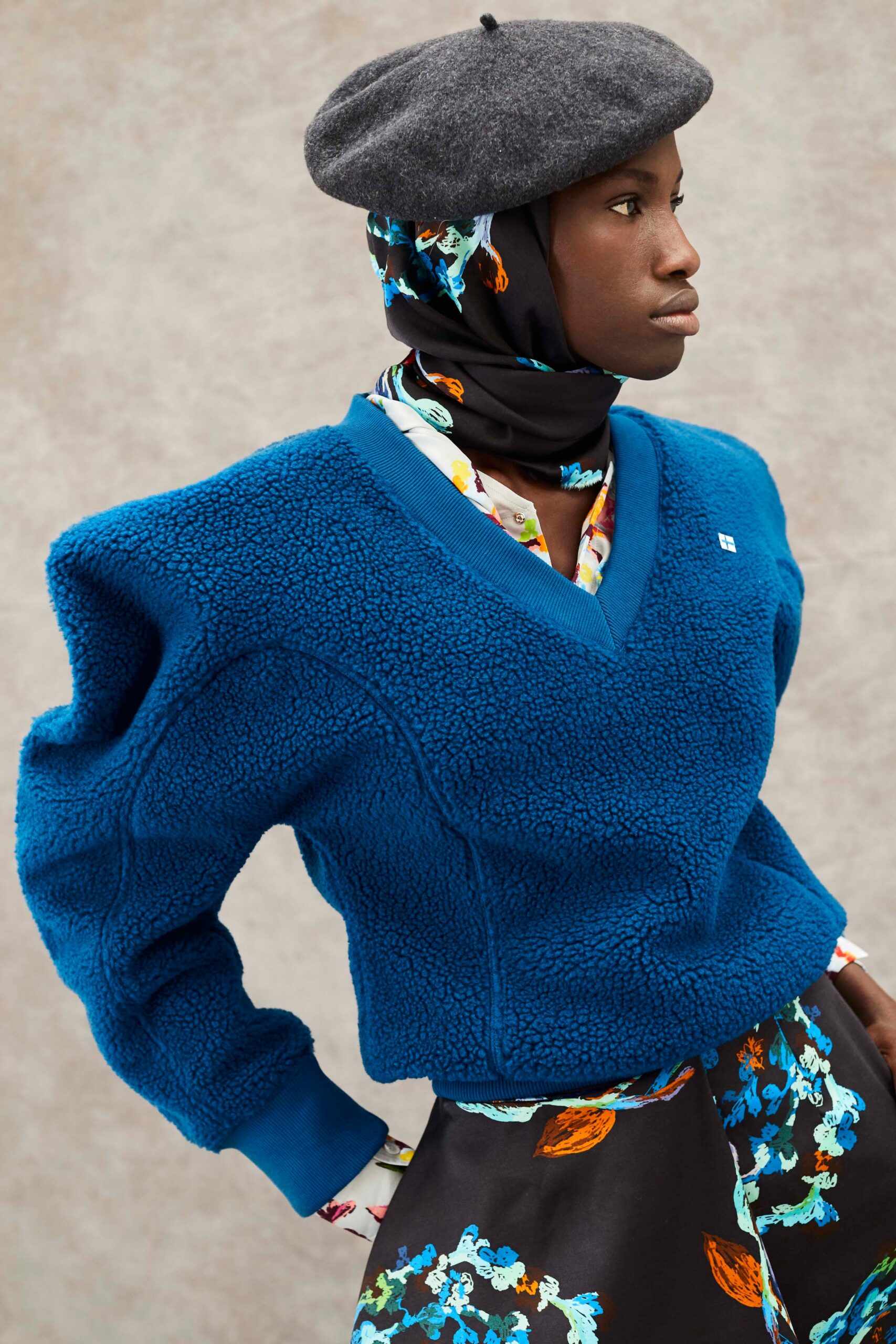 blue faux-fur sweater and black skirt