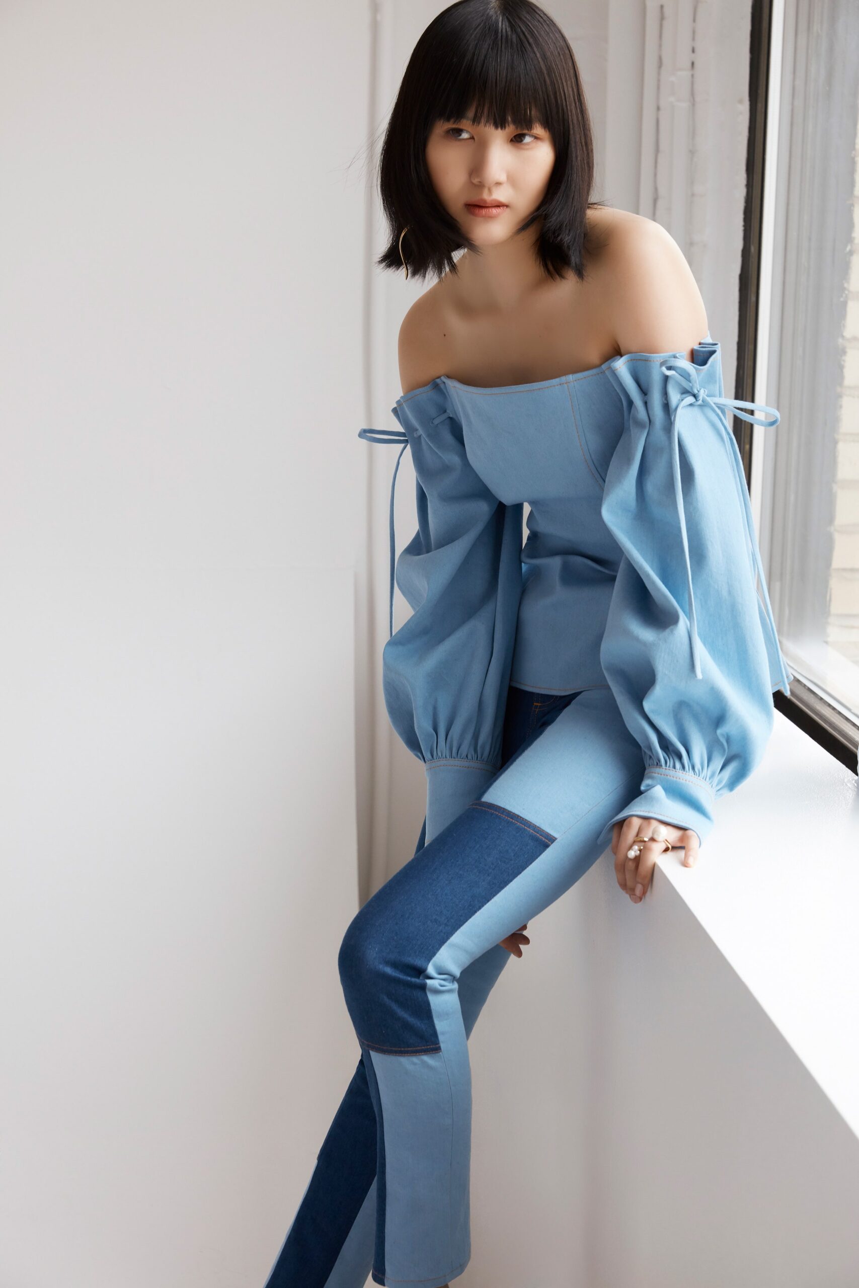 blue off-shoulder top with slim pants
