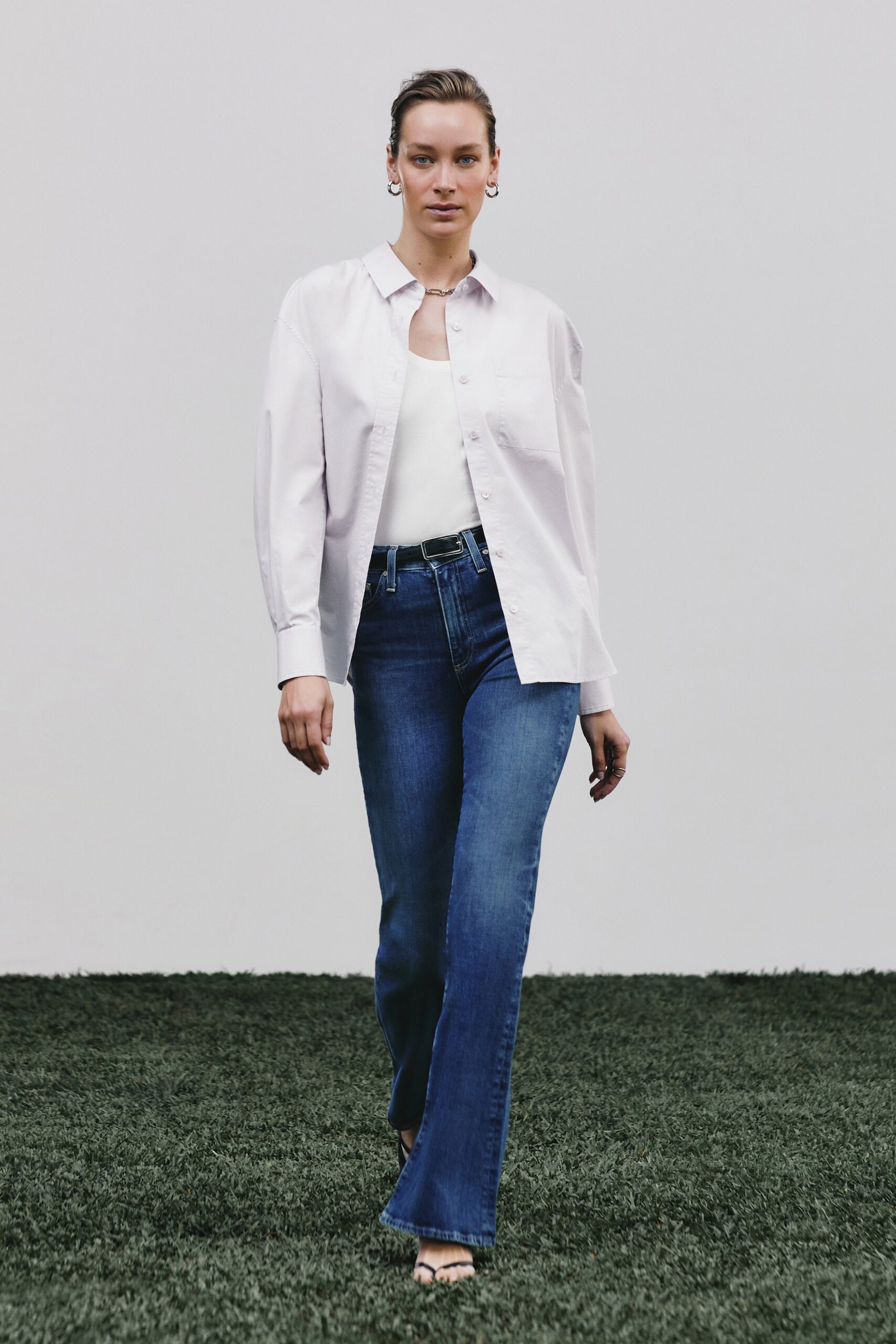 white shirt and blue jeans